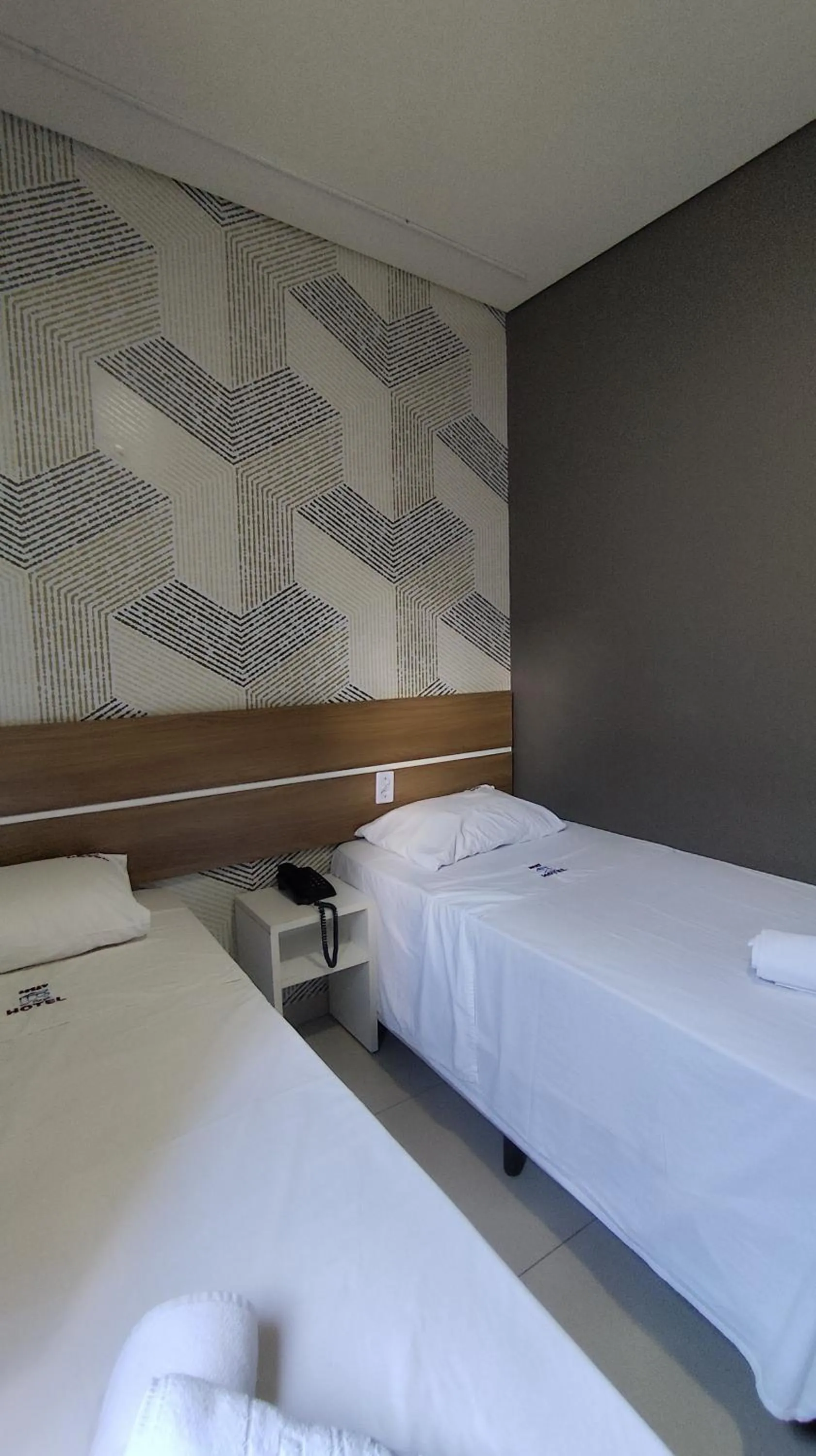 Bed in Assay Plaza Hotel