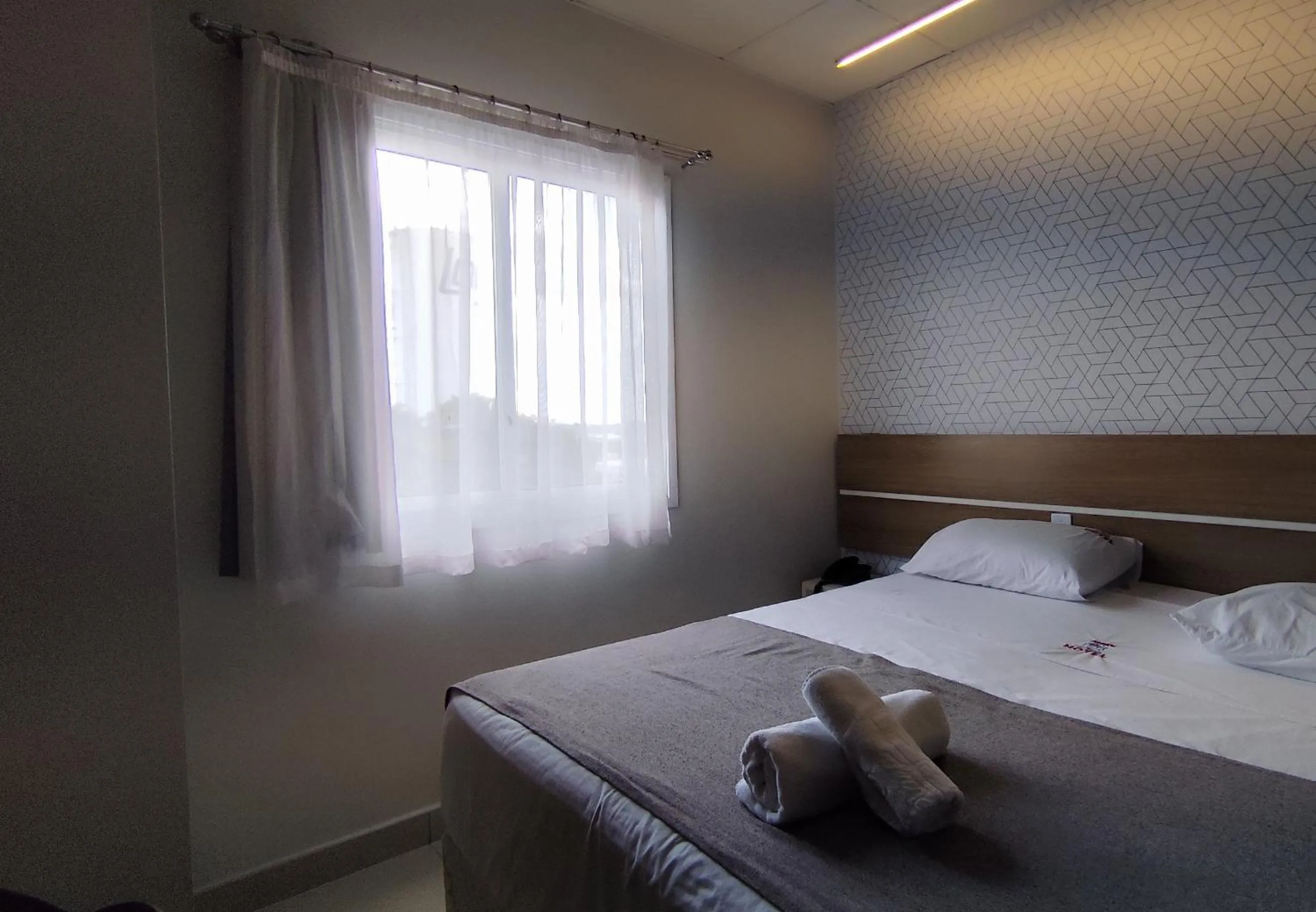 Bed in Assay Plaza Hotel