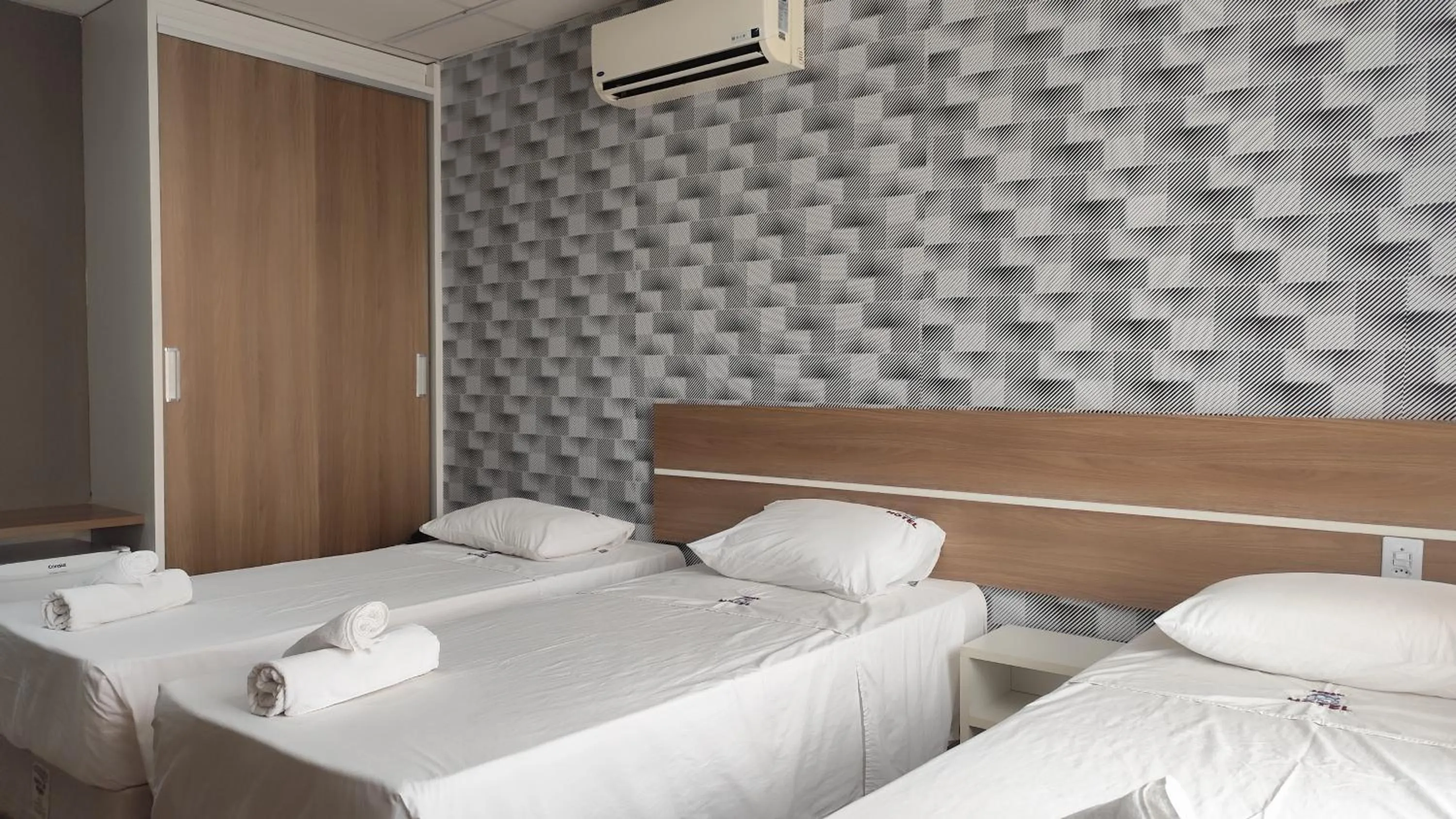 Bed in Assay Plaza Hotel