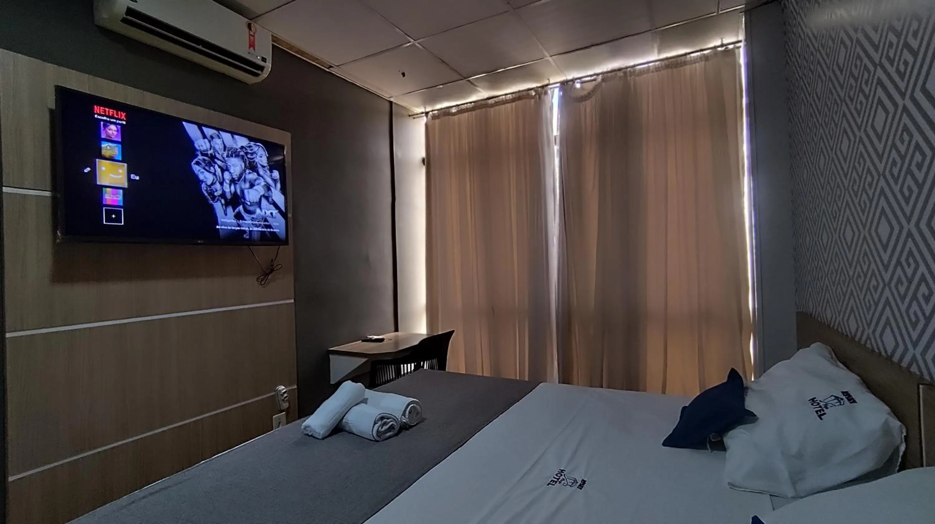 Bed in Assay Plaza Hotel