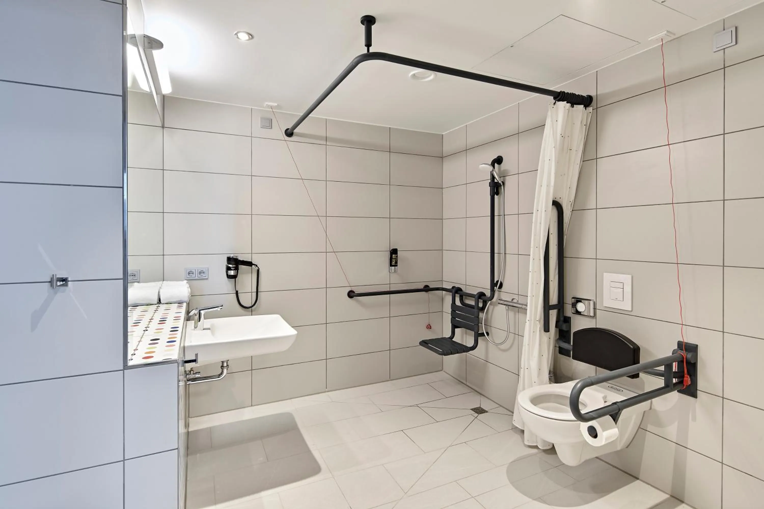 Bathroom in MEININGER Hotel Köln West