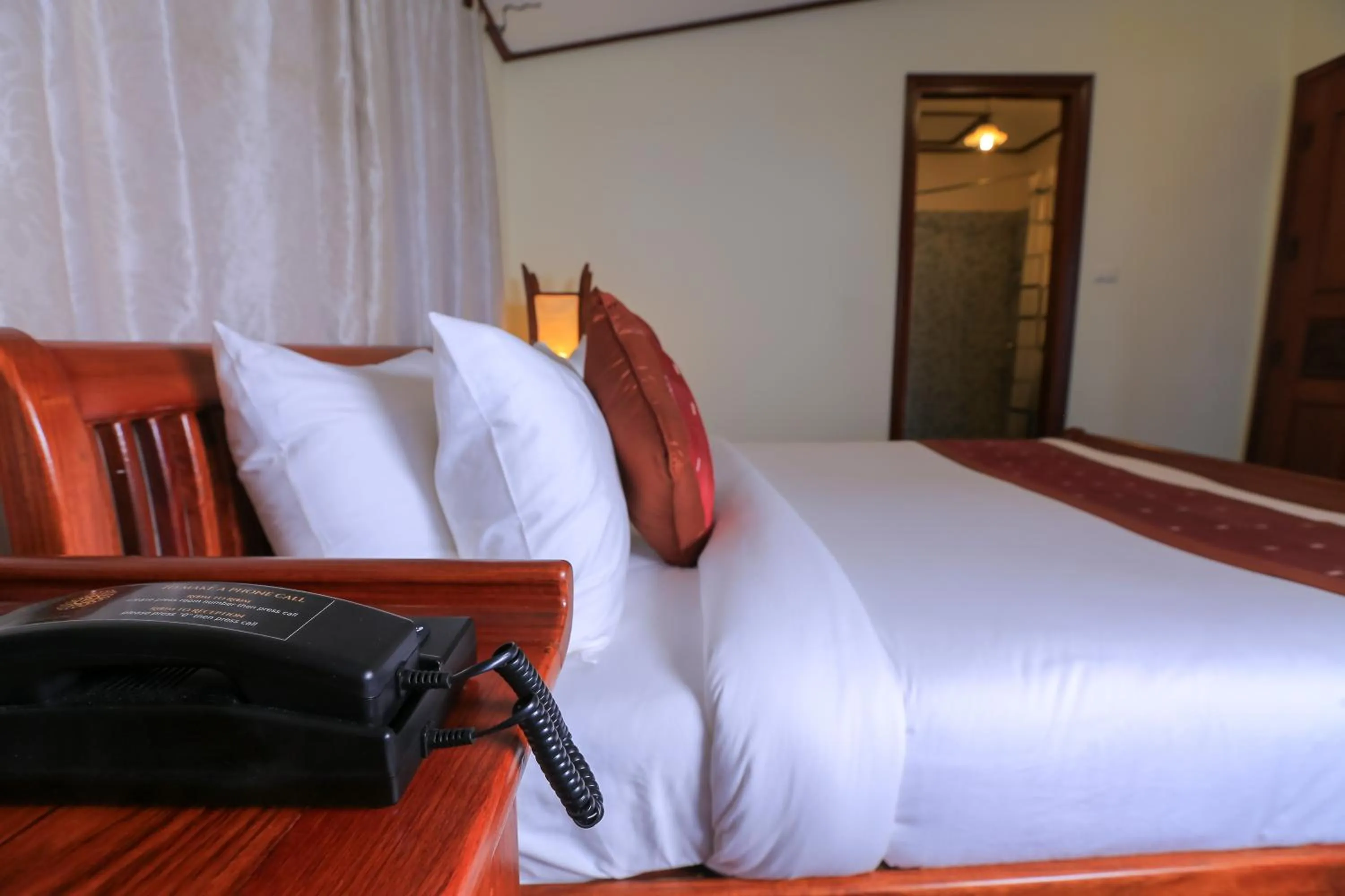 Bed in Phongsavath Boutique Hotel