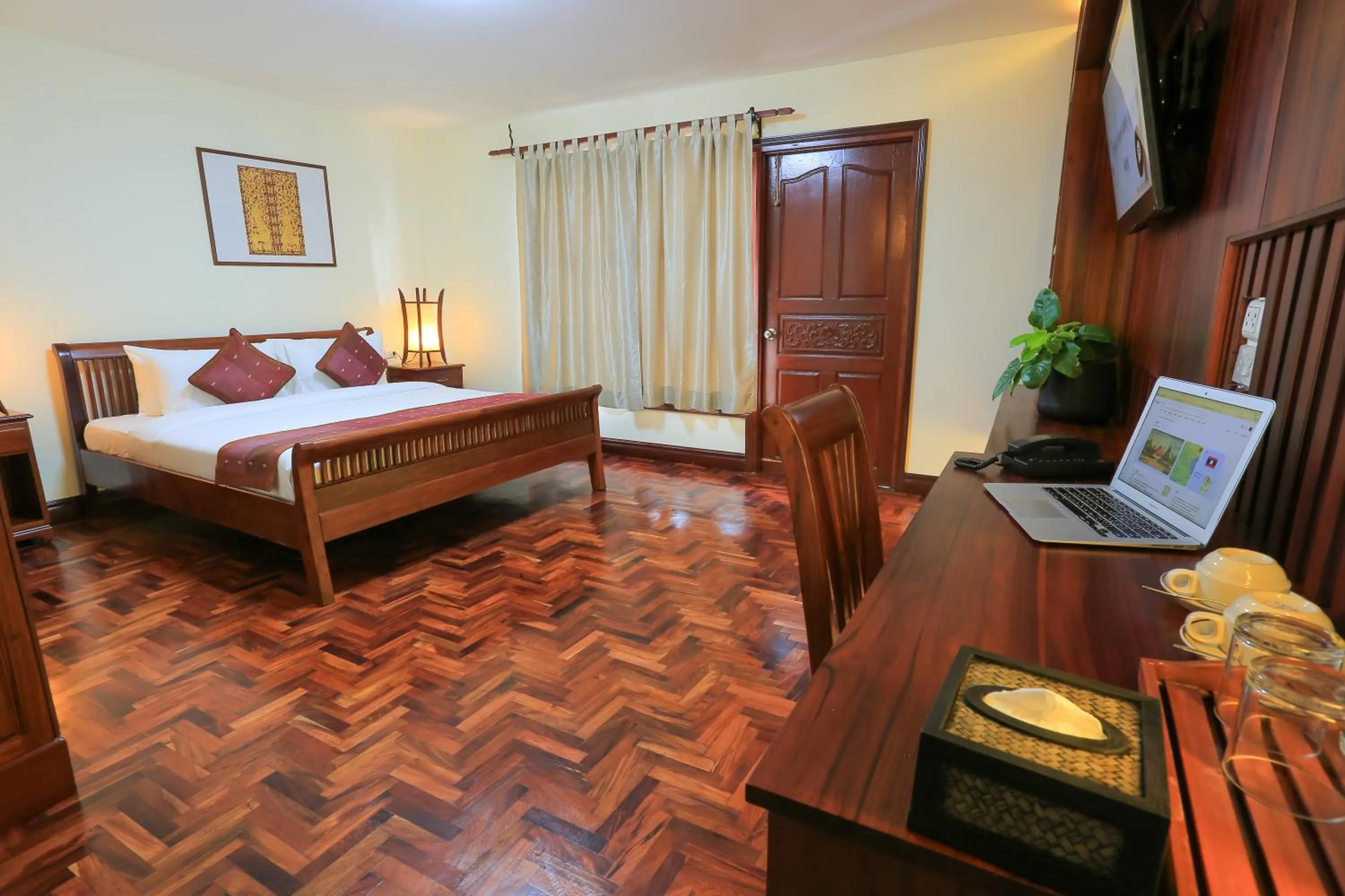 Bed in Phongsavath Boutique Hotel