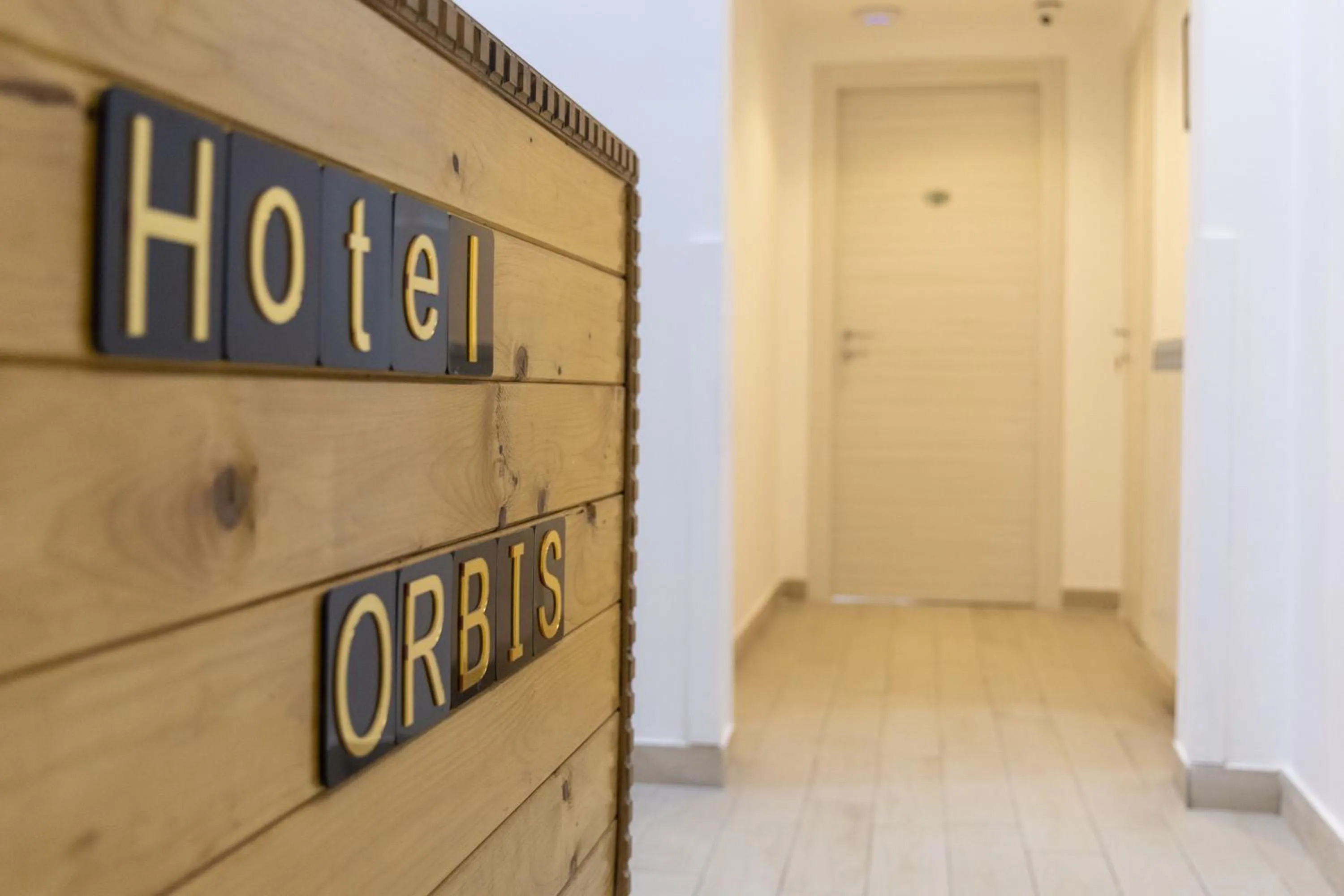 Property logo or sign in Hotel Orbis