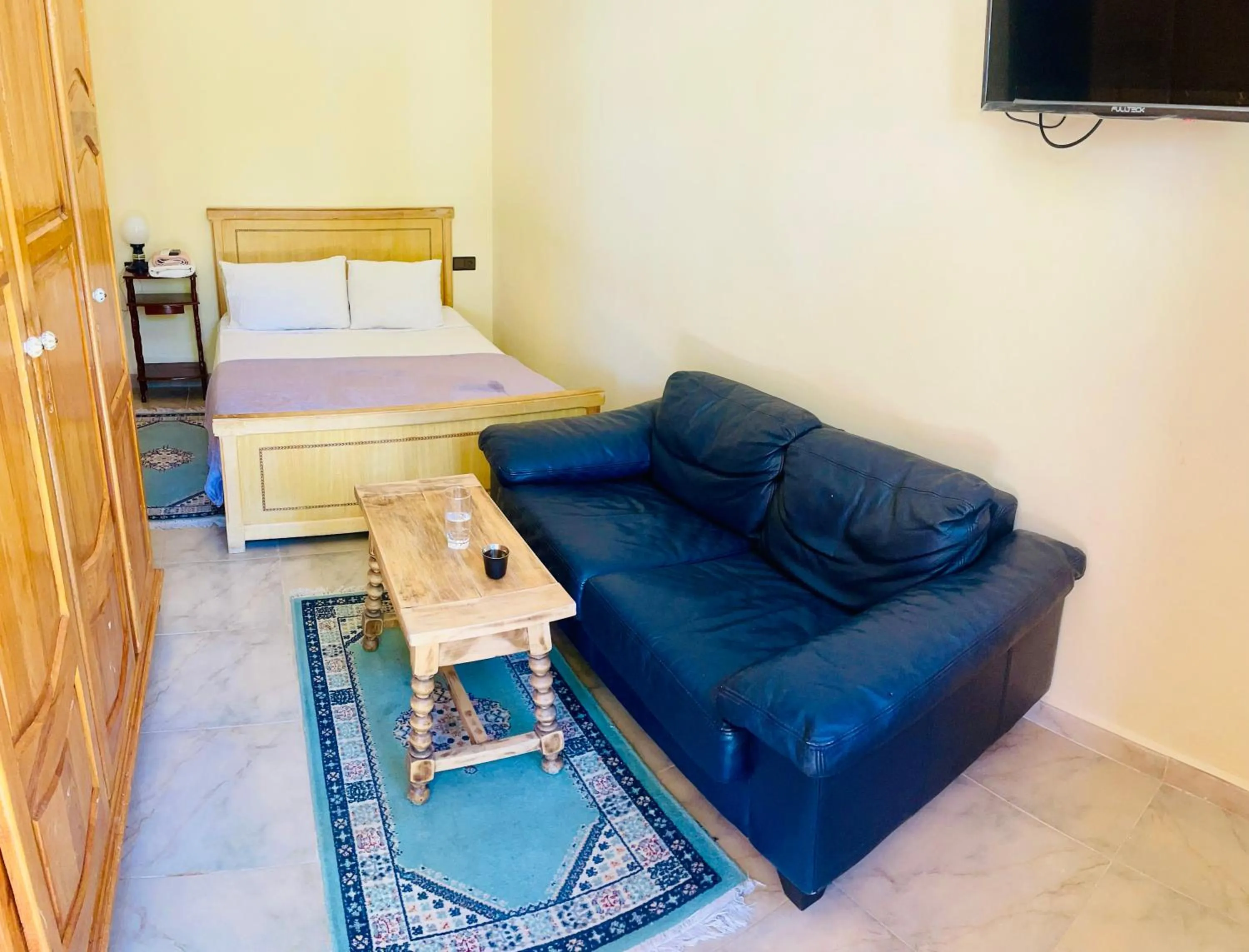 Communal lounge/ TV room, Bed in Villa Baddi Marrakech