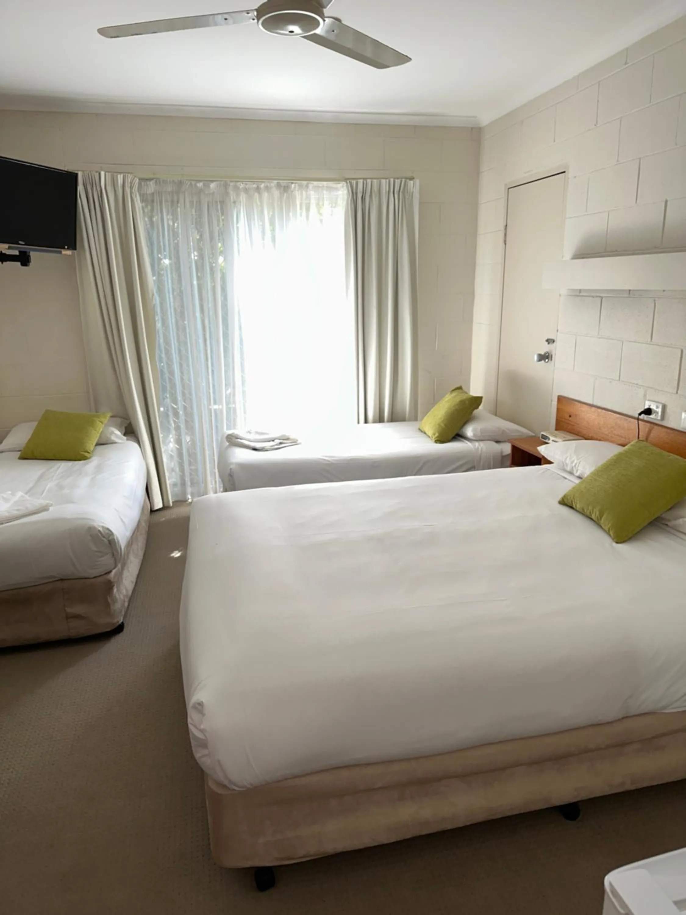 Bed in Corlette Palms Motor Inn