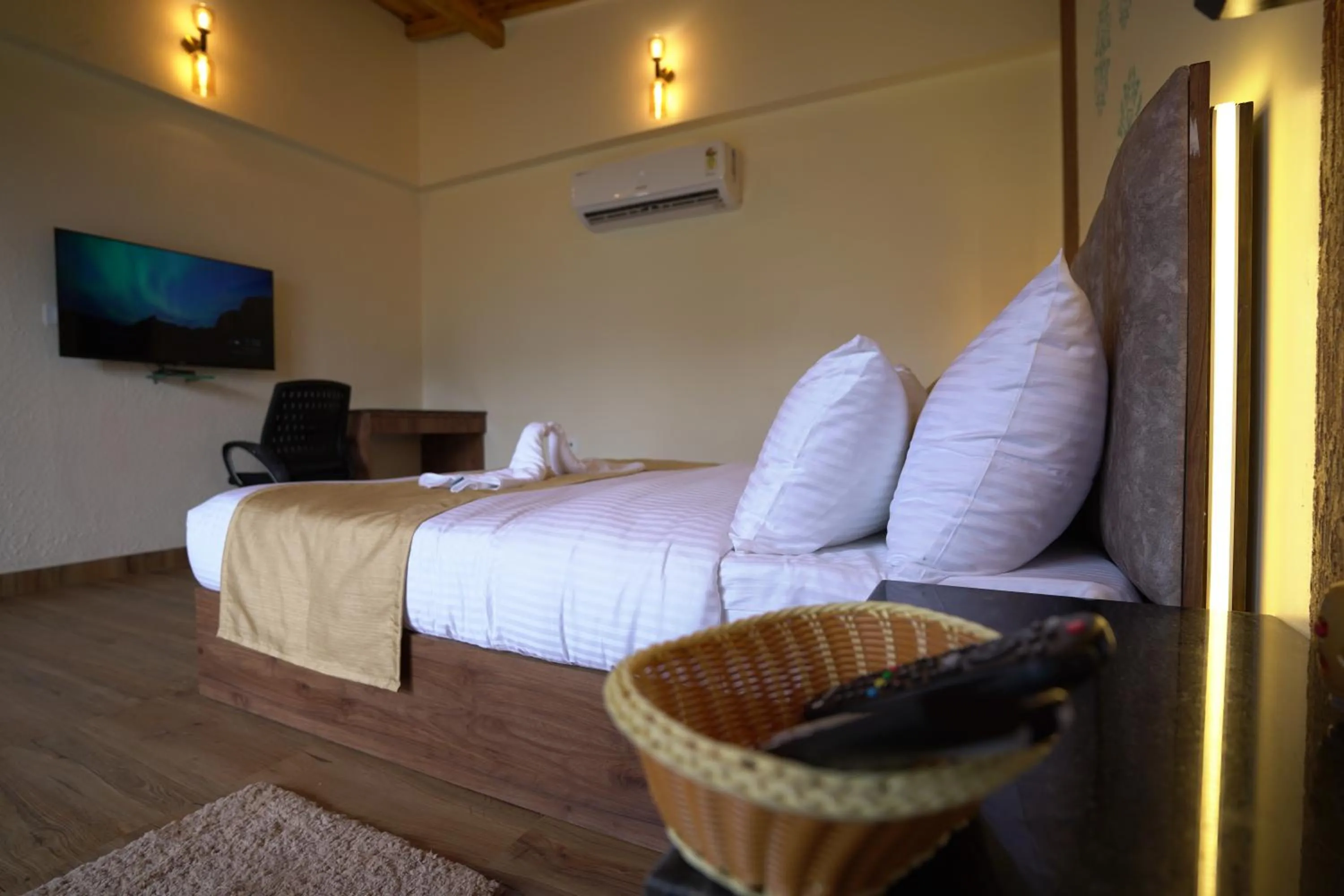 Bed in NIVEDAN HOTEL AND RESORT
