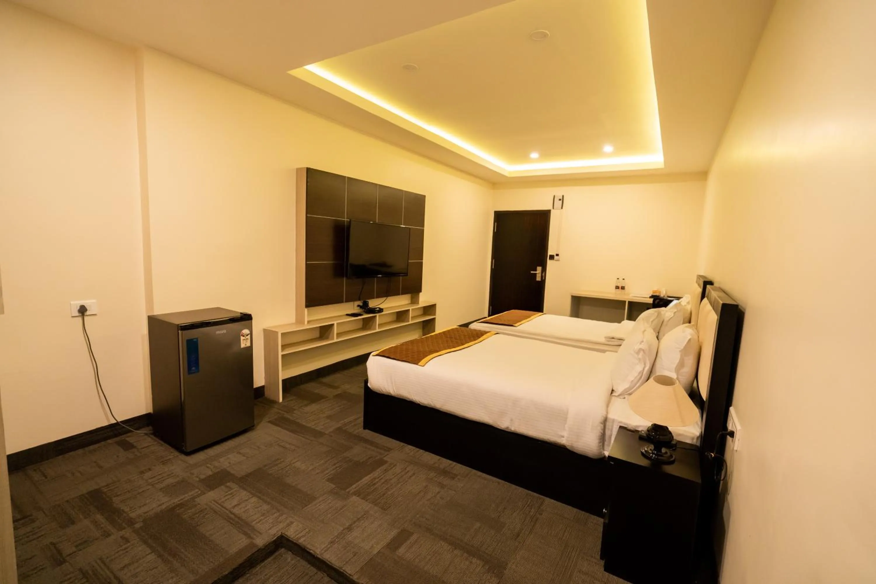 Bed in ROYALE LALAWI HOTEL