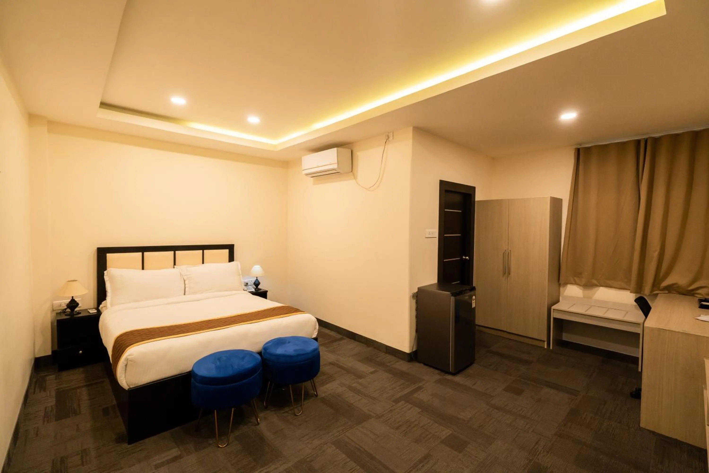 Bed in ROYALE LALAWI HOTEL