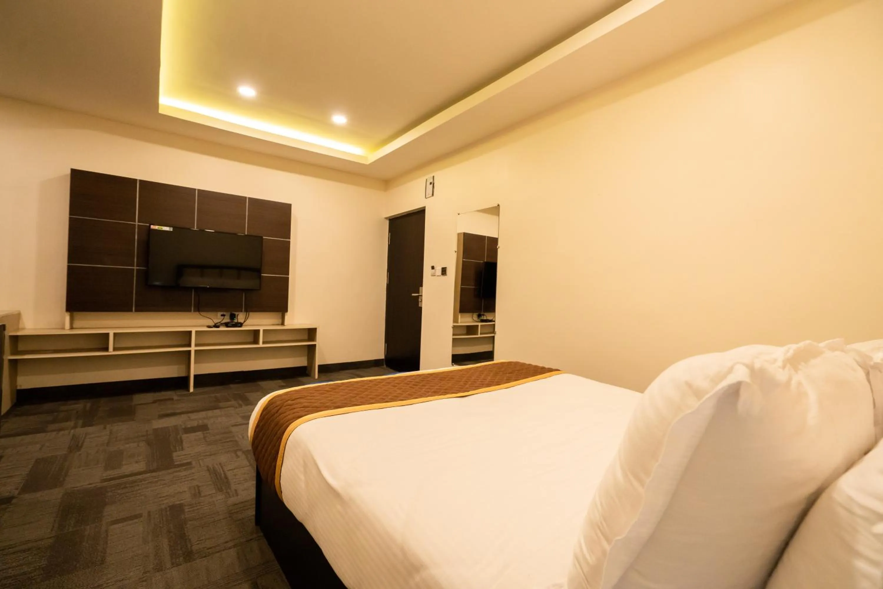 Bed in ROYALE LALAWI HOTEL