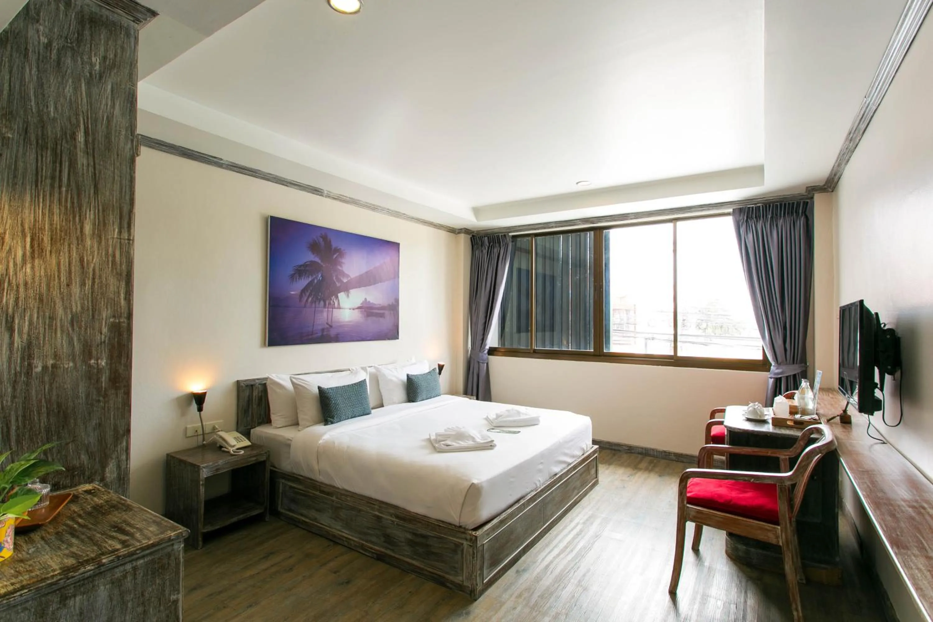 Bed in JALMIN Hotel Samui