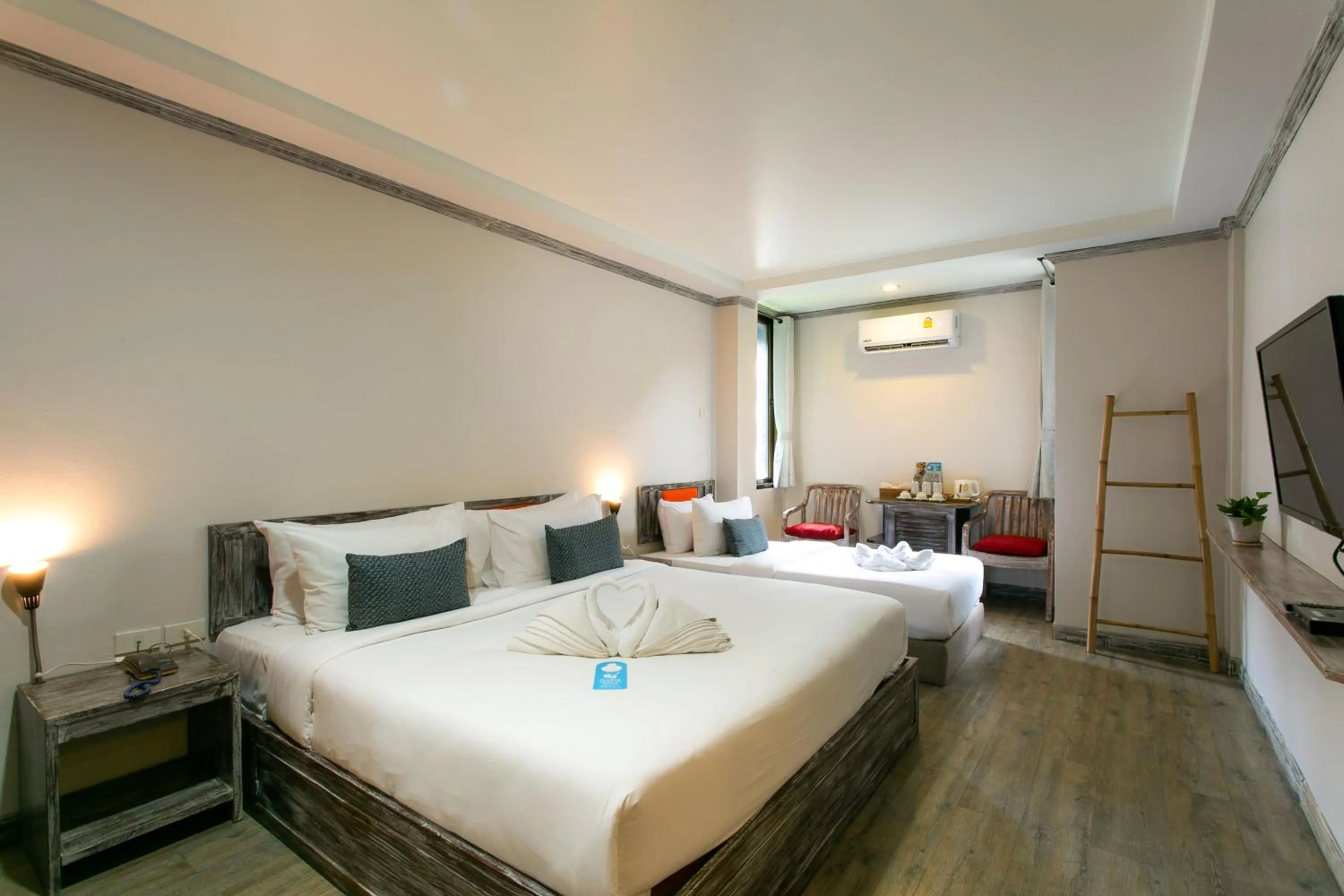 Bed in JALMIN Hotel Samui