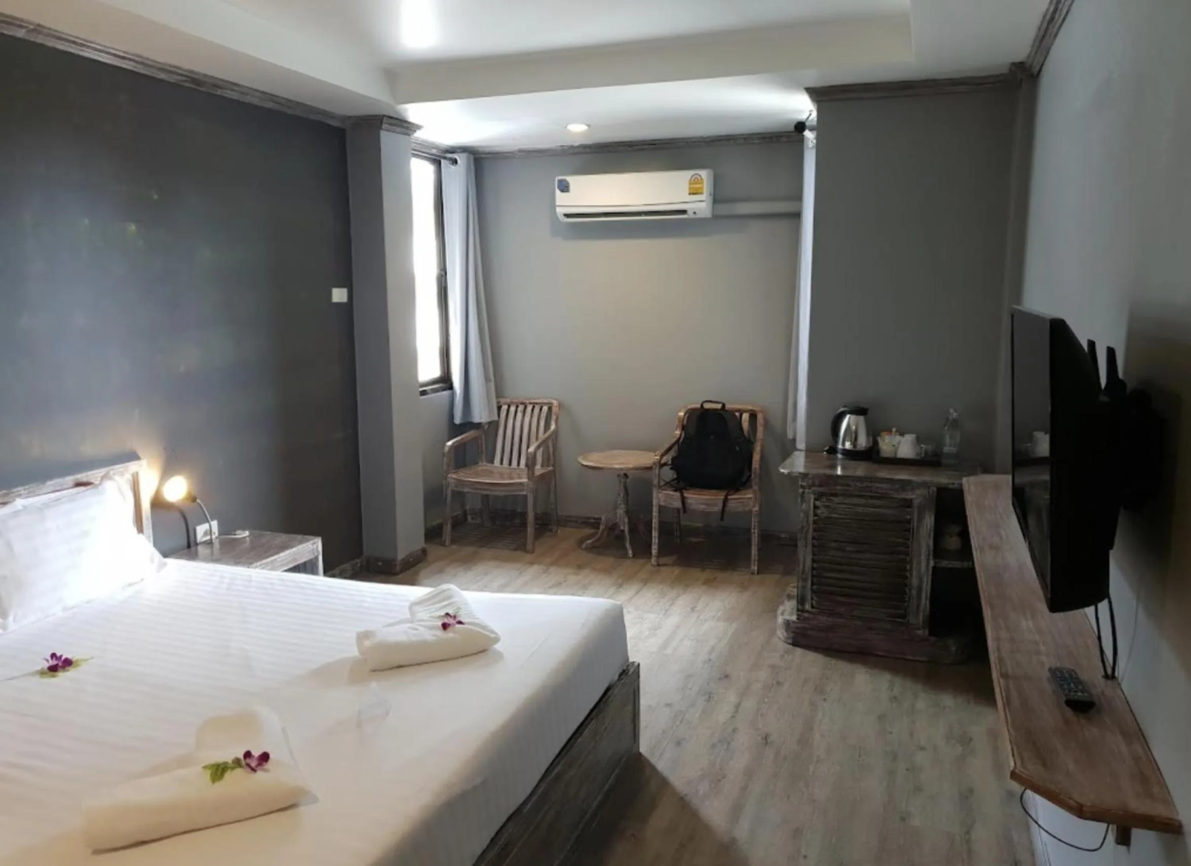 Bed in JALMIN Hotel Samui