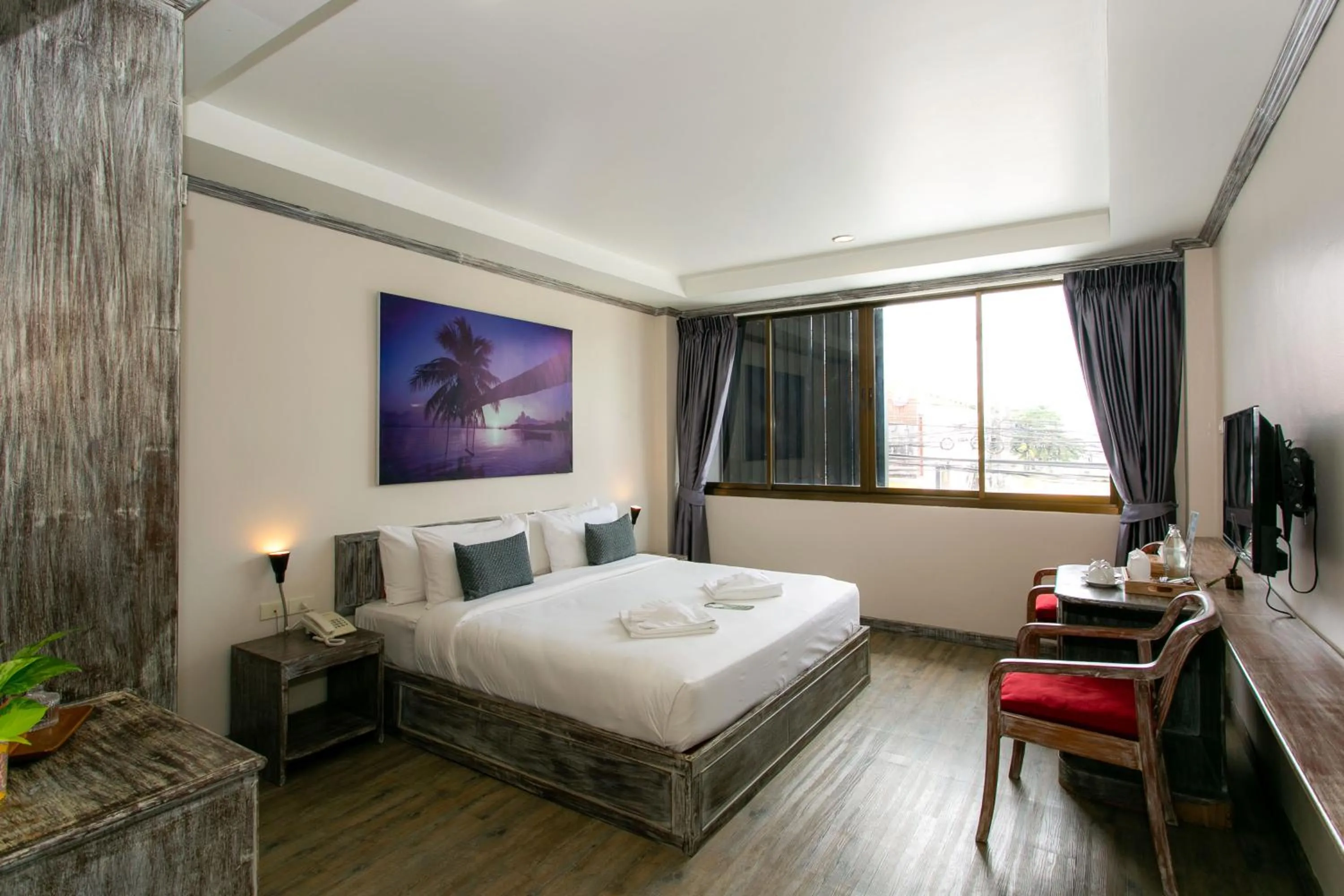 Bed in JALMIN Hotel Samui