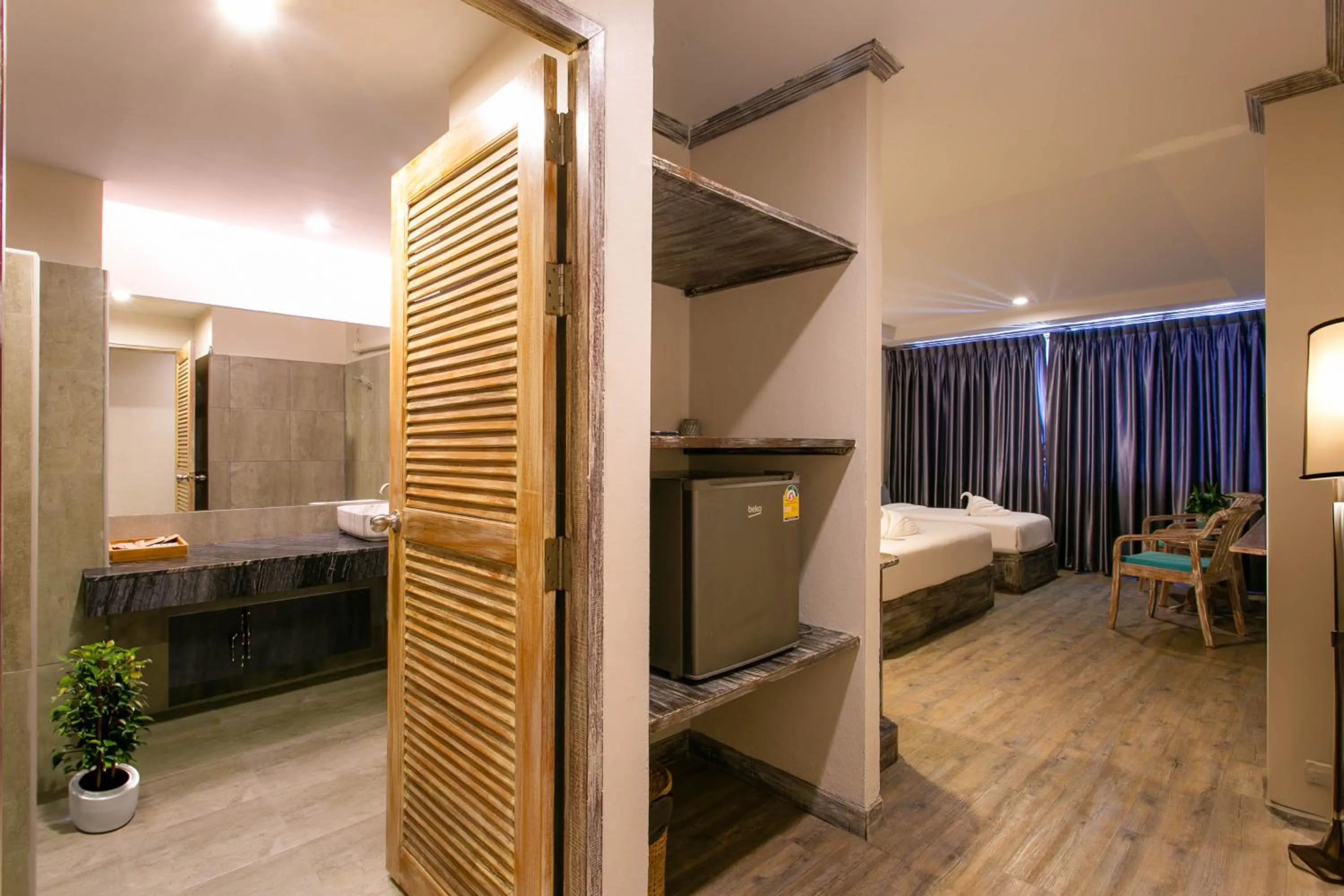 Bed in JALMIN Hotel Samui