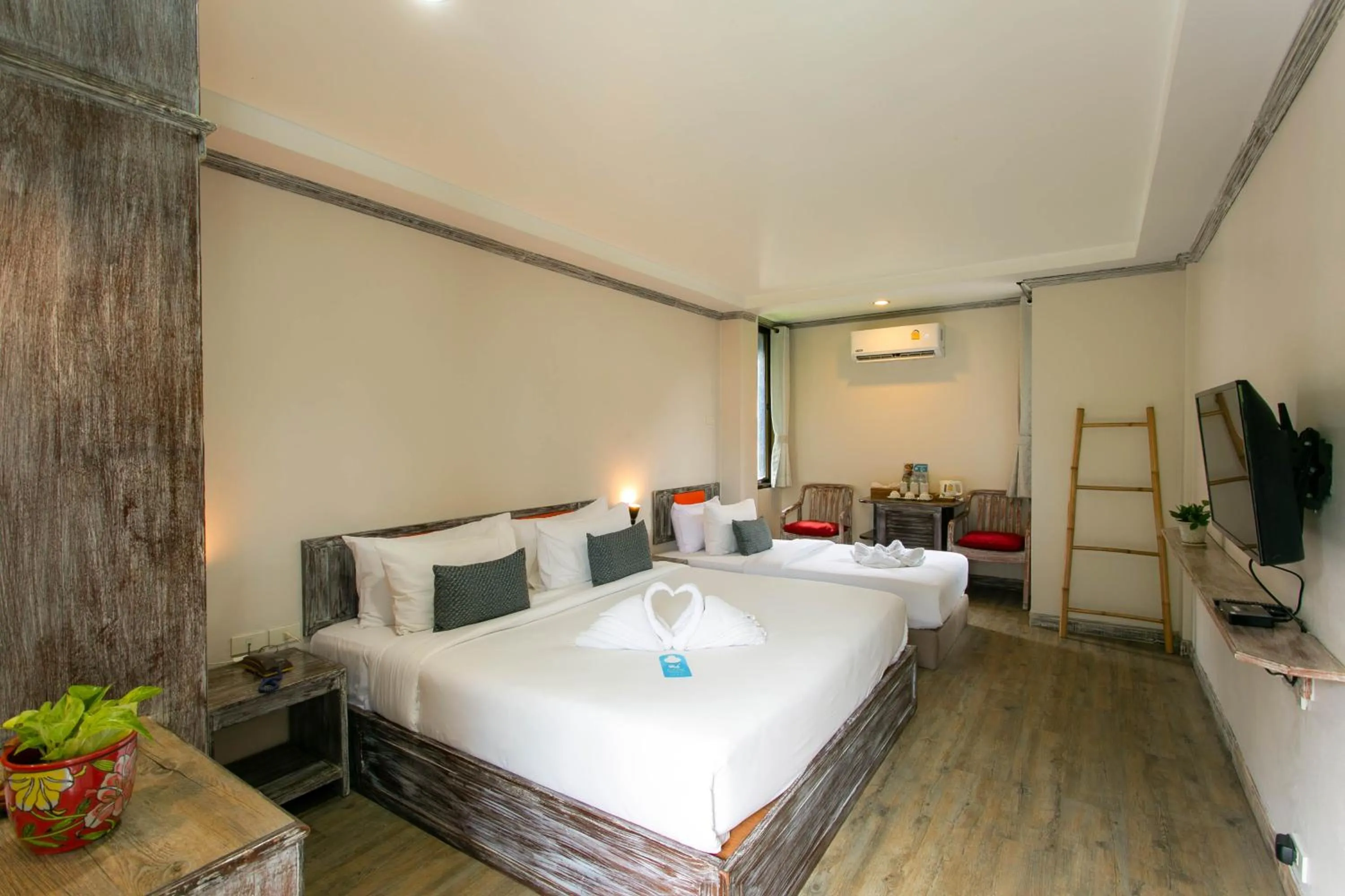 Bed in JALMIN Hotel Samui