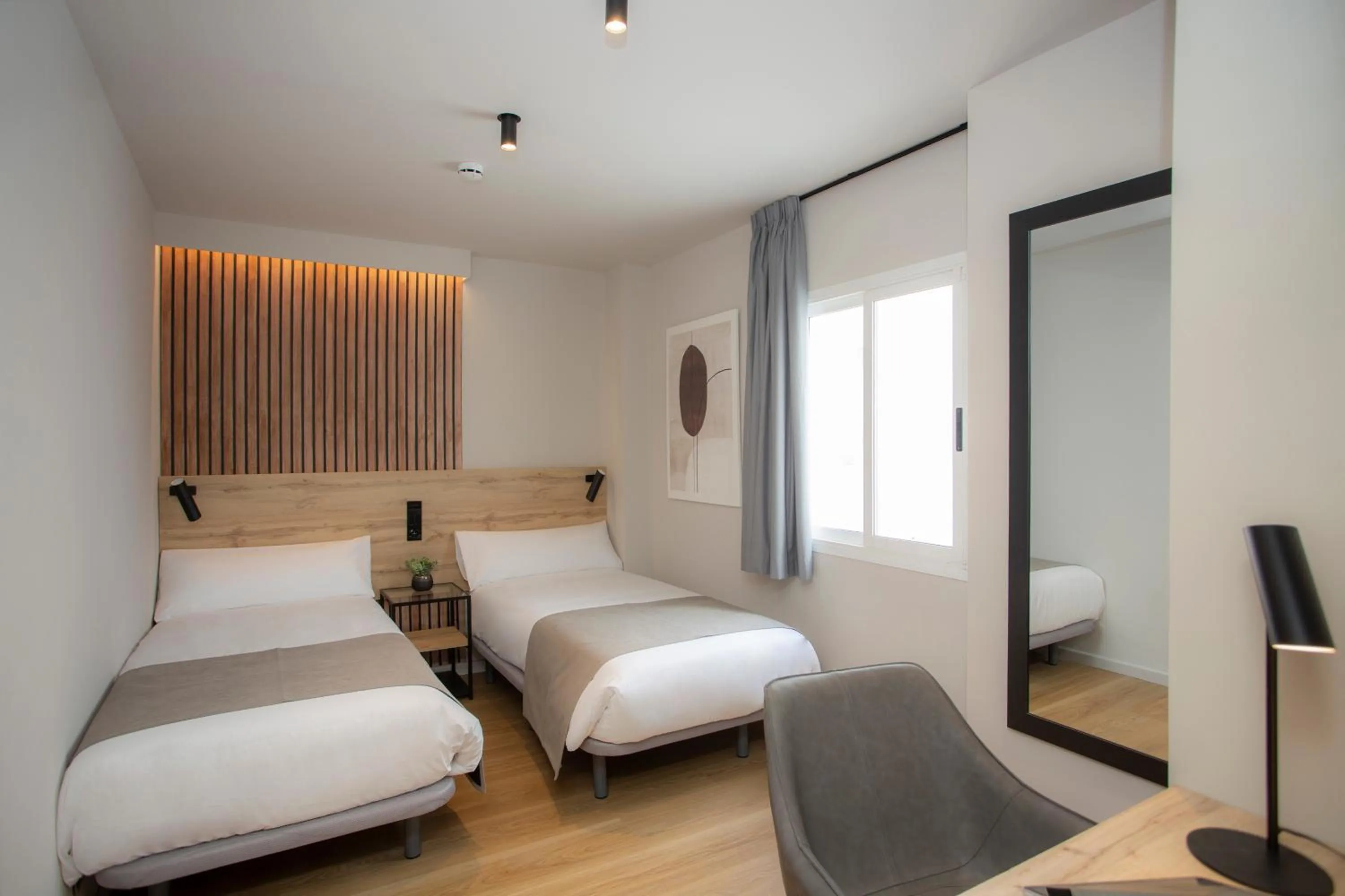 Bed in Aila II Hotel Boutique by SingularStays - Digital Access