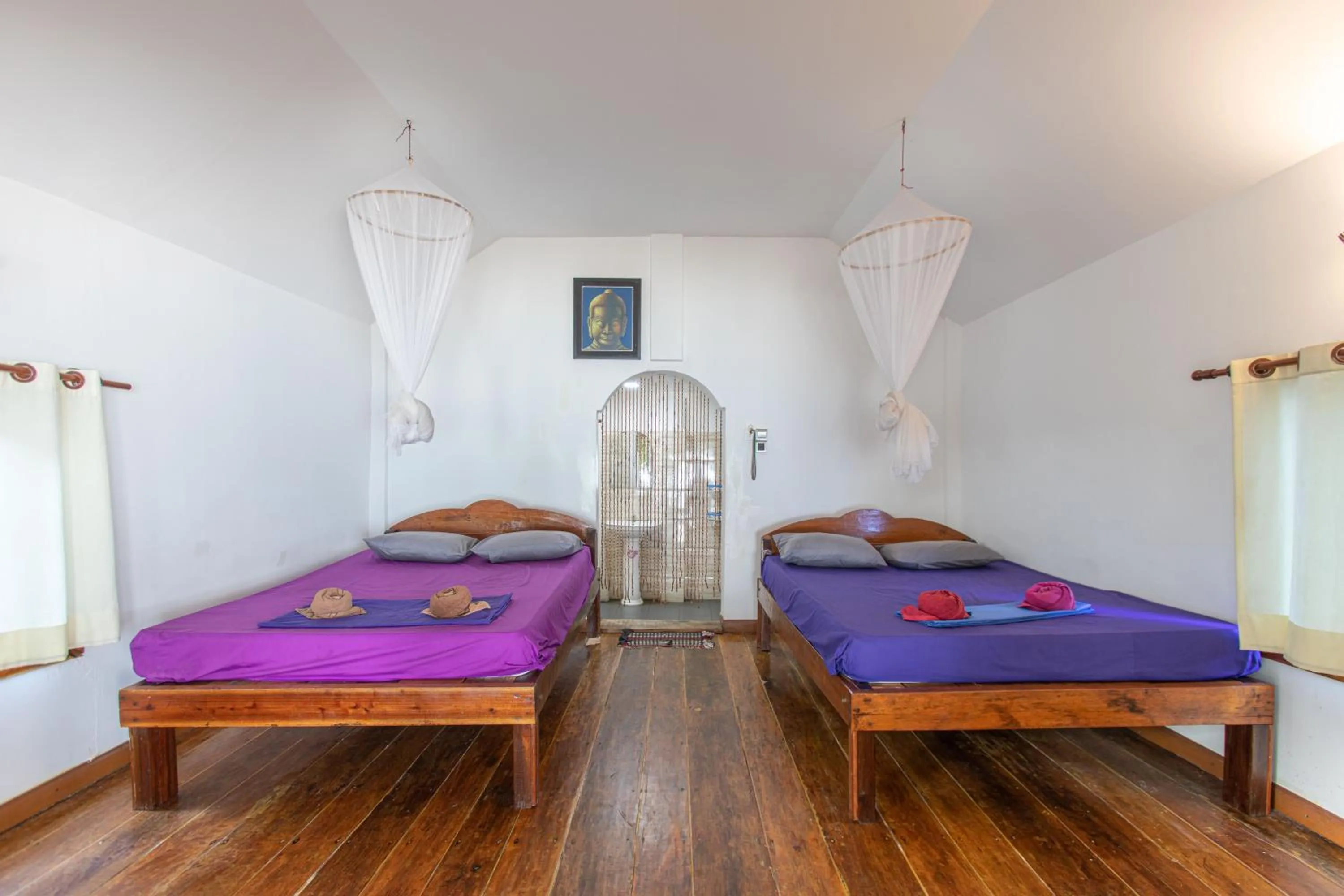 Bed in White Beach Bungalows