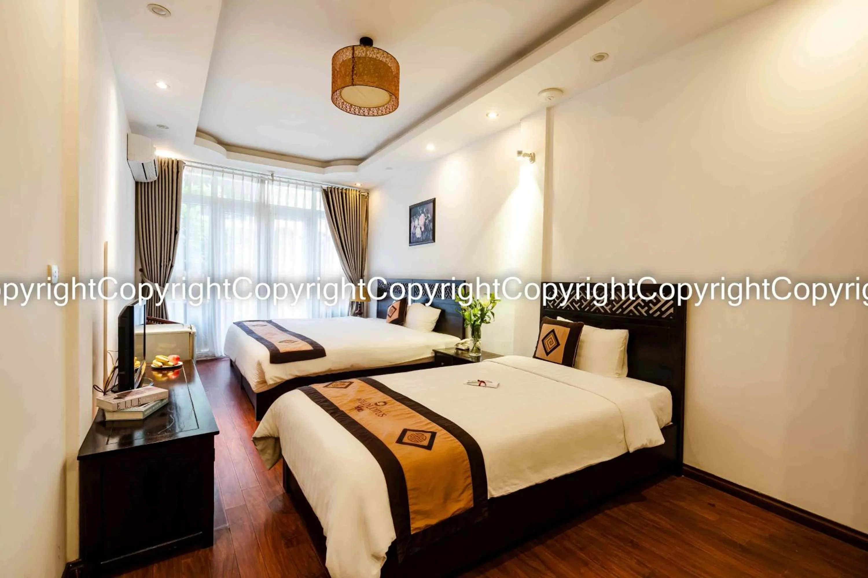 Bed in Wild Lotus Hotel & Travel 2