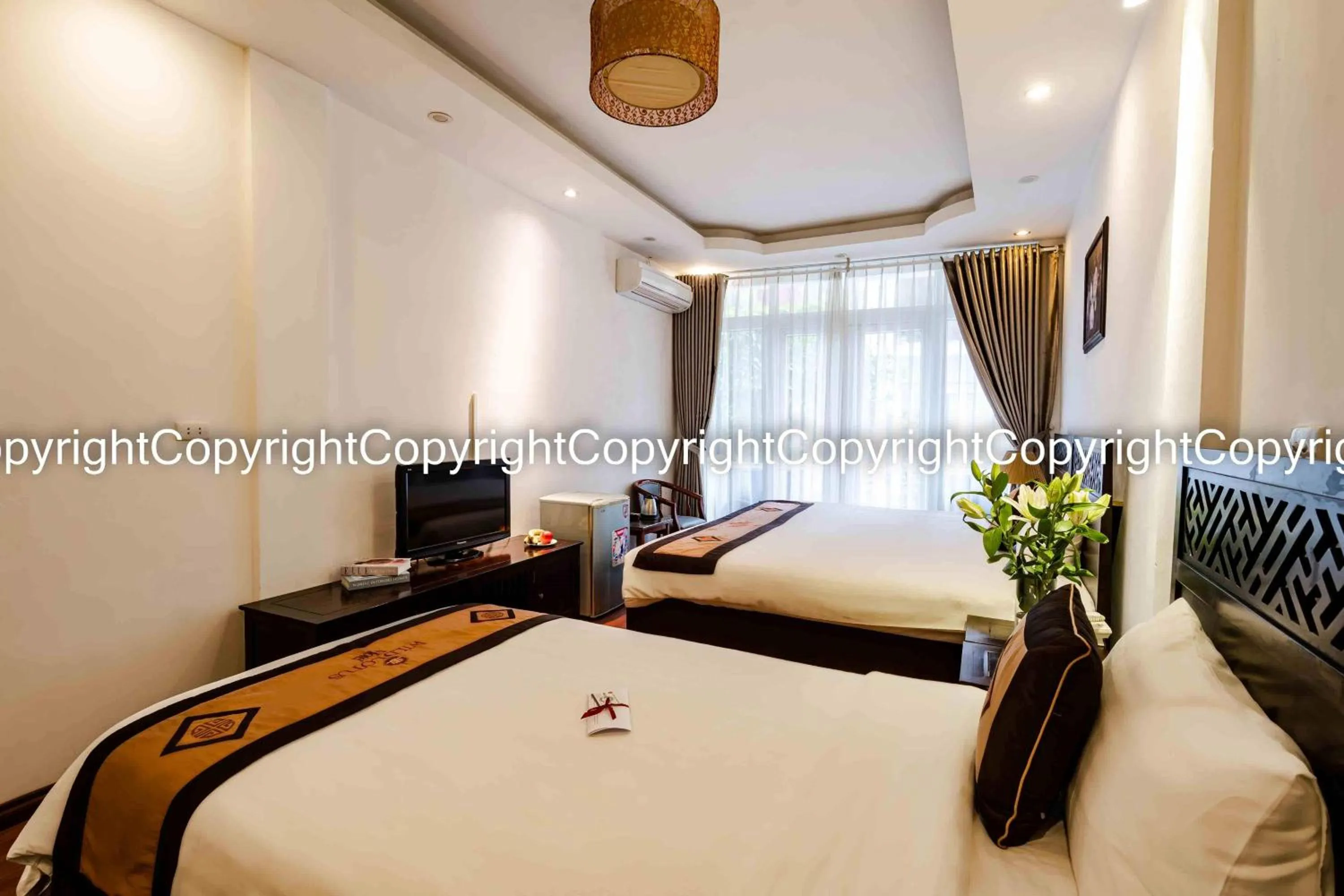 Bed in Wild Lotus Hotel & Travel 2