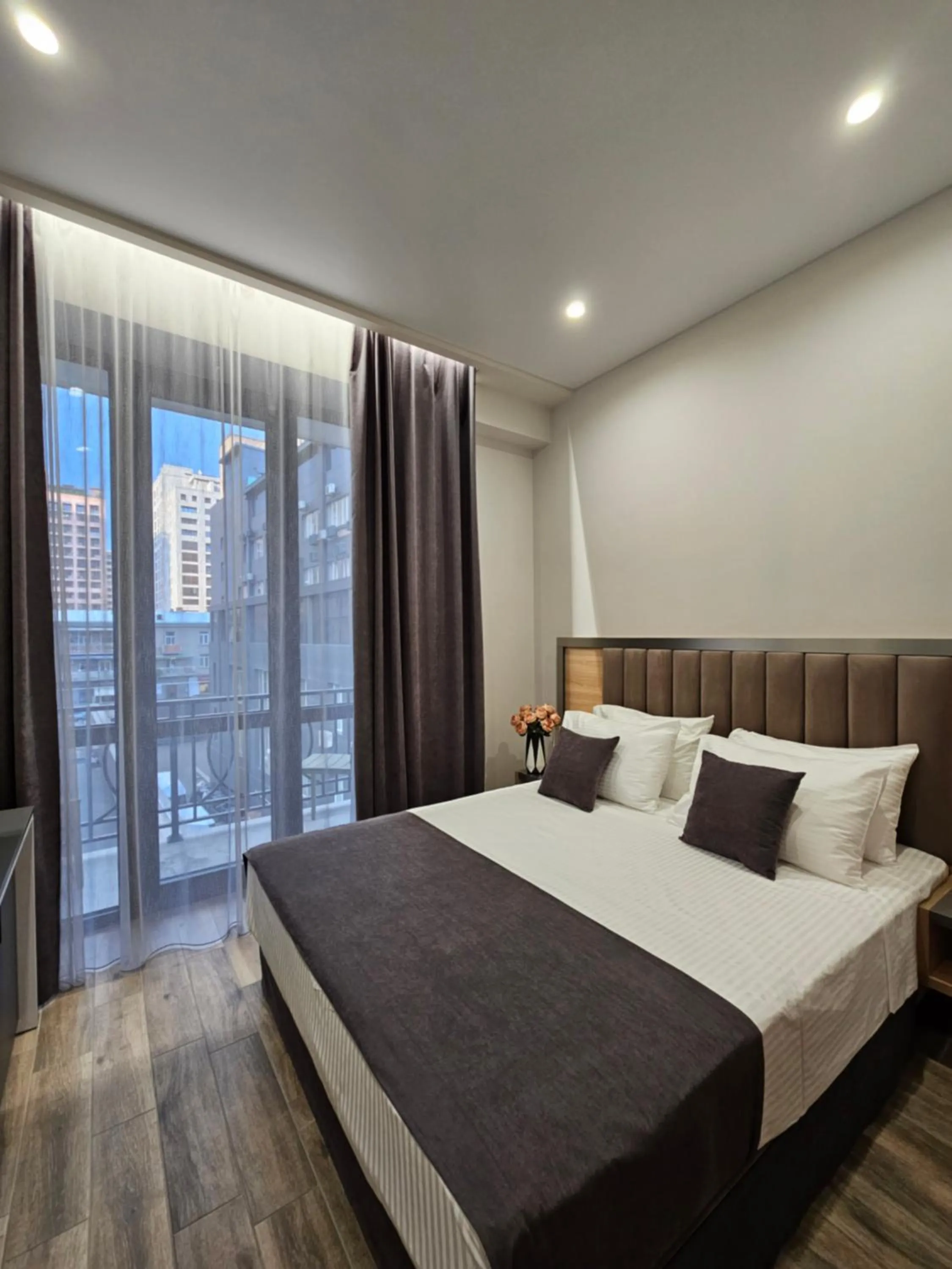 Bed in Orion ApartHotel