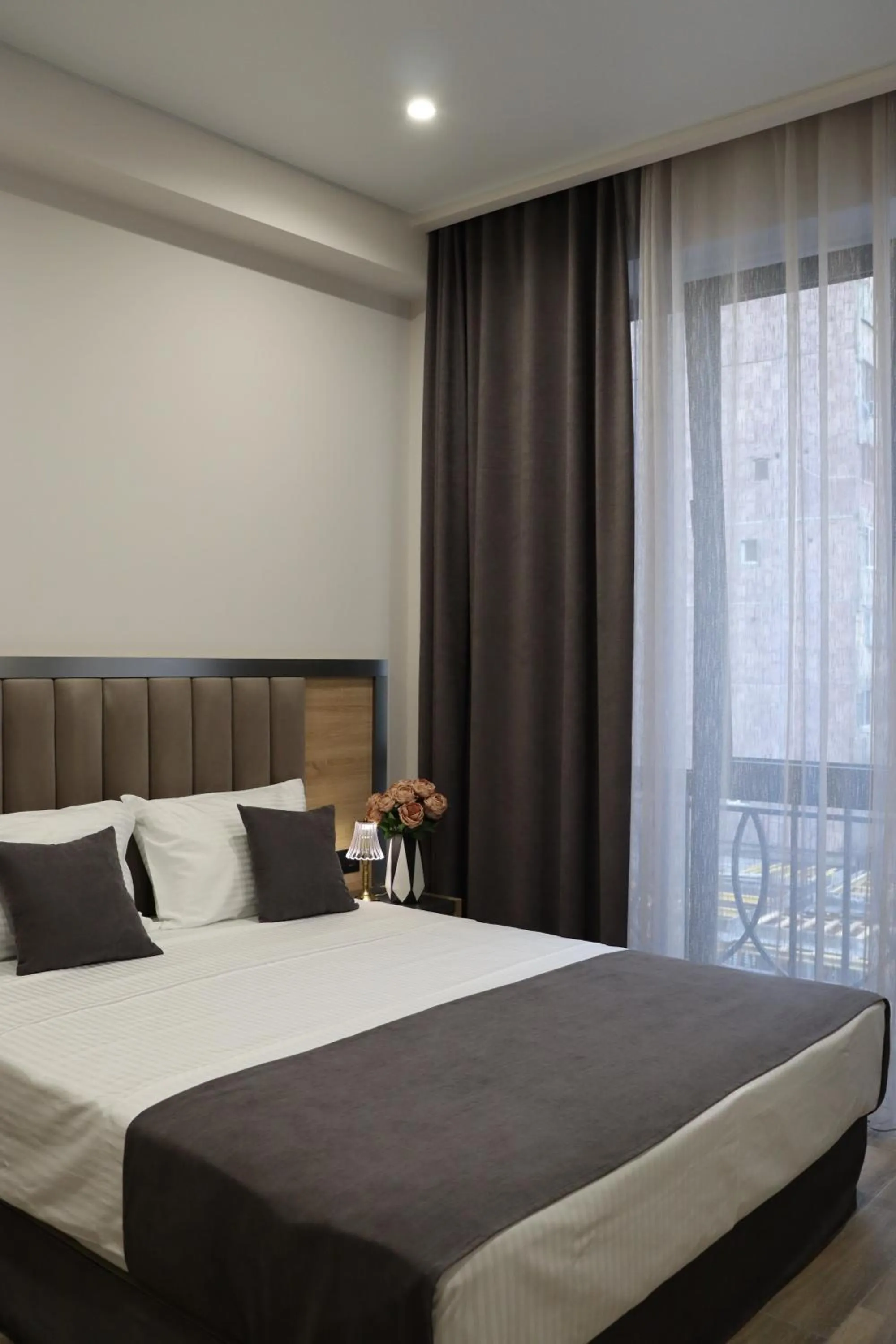 Bed in Orion ApartHotel