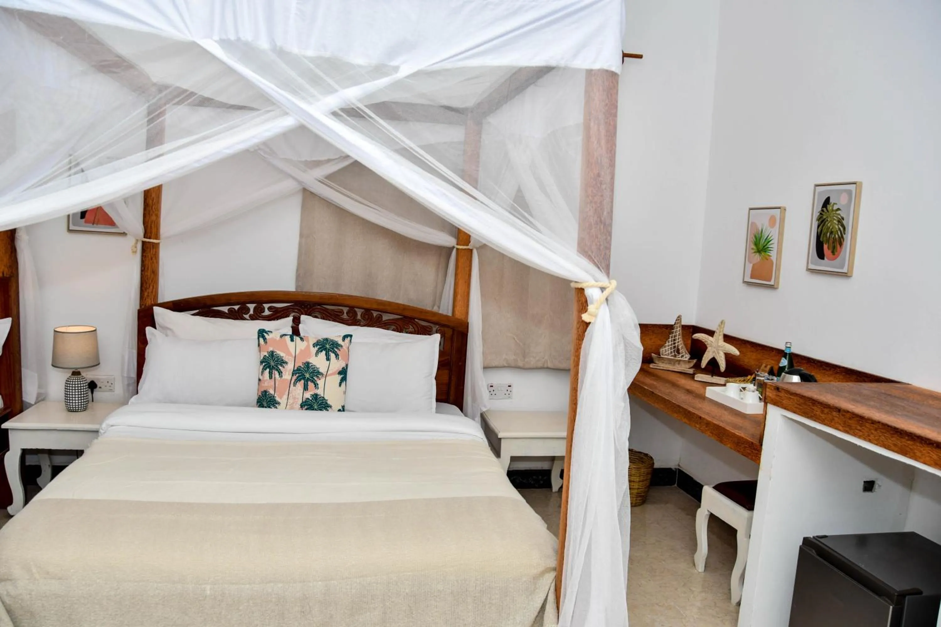 Photo of the whole room, Bed in Coral Bay Zanzibar