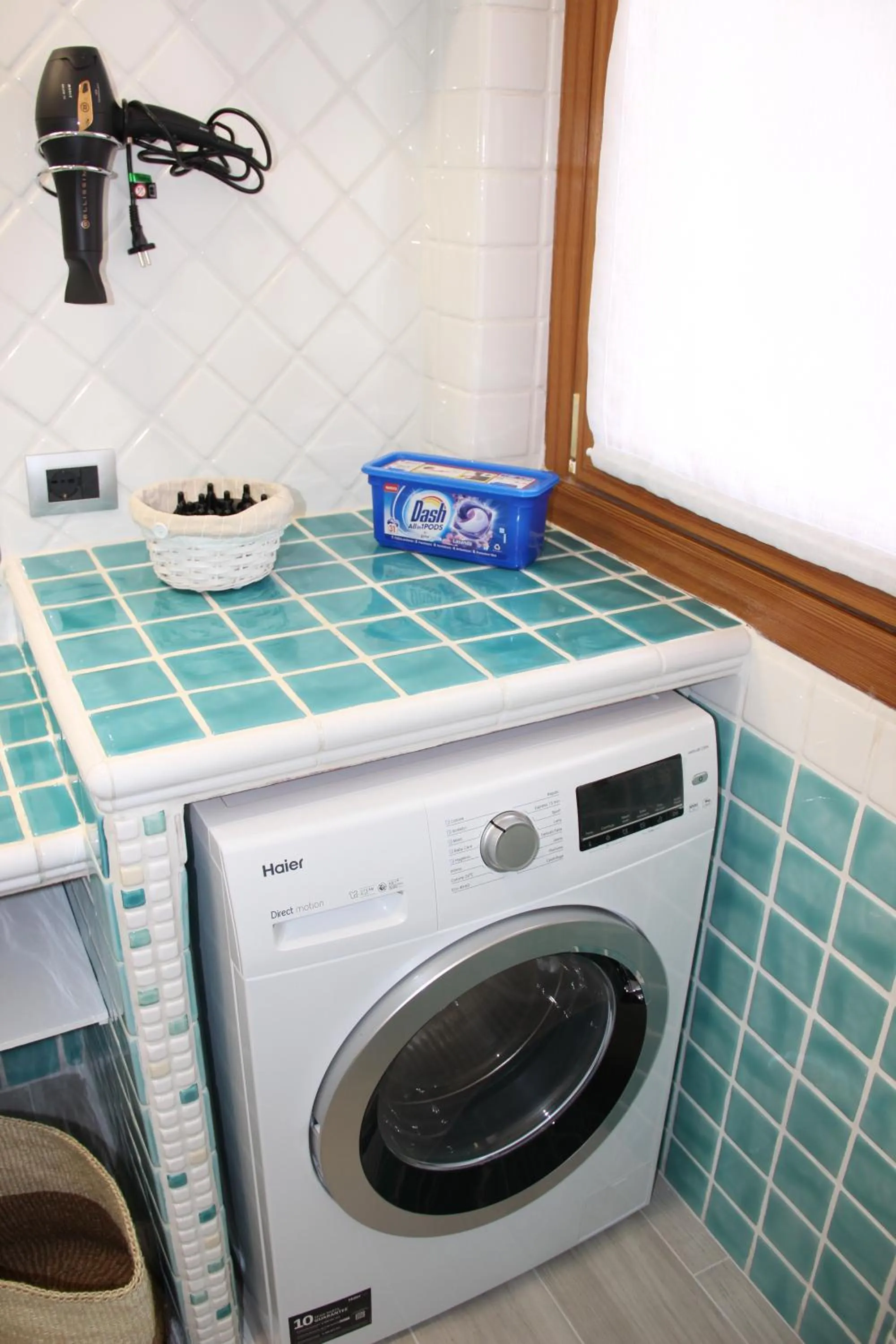 washing machine in Appartamento Lungomare Toscanelli