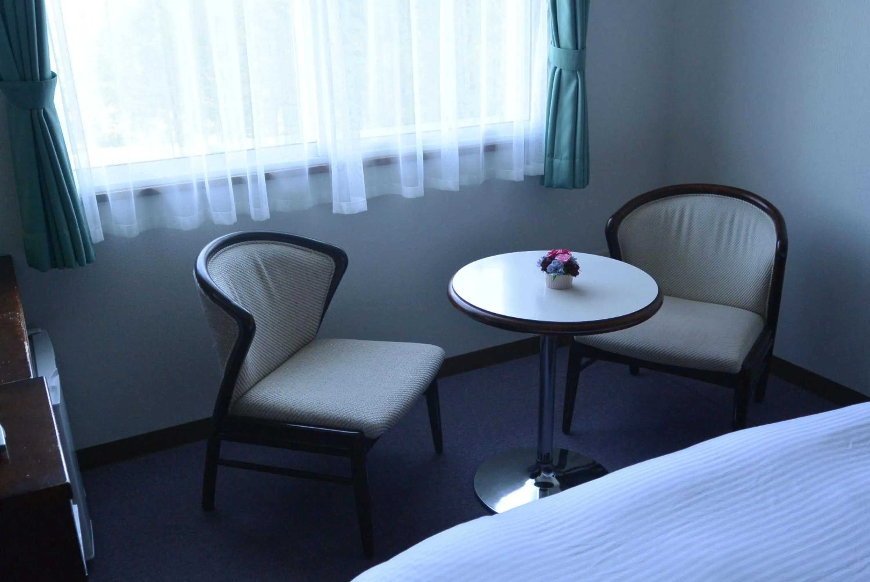 Seating area, Bed in Highland Furano