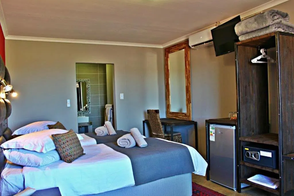 Photo of the whole room, Bed in Opuwo Country Lodge