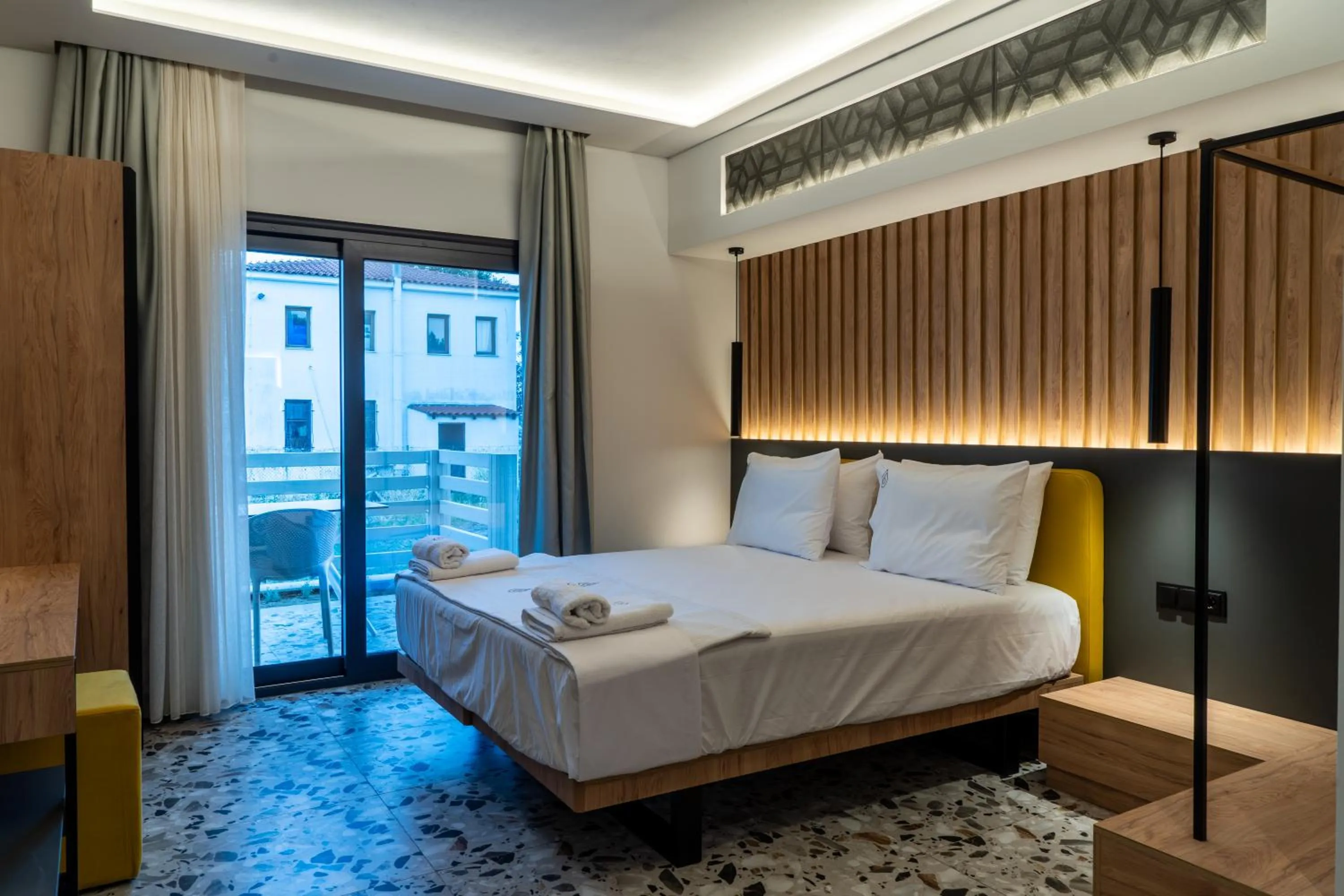 Bed in NERO SEASCAPE SUITES