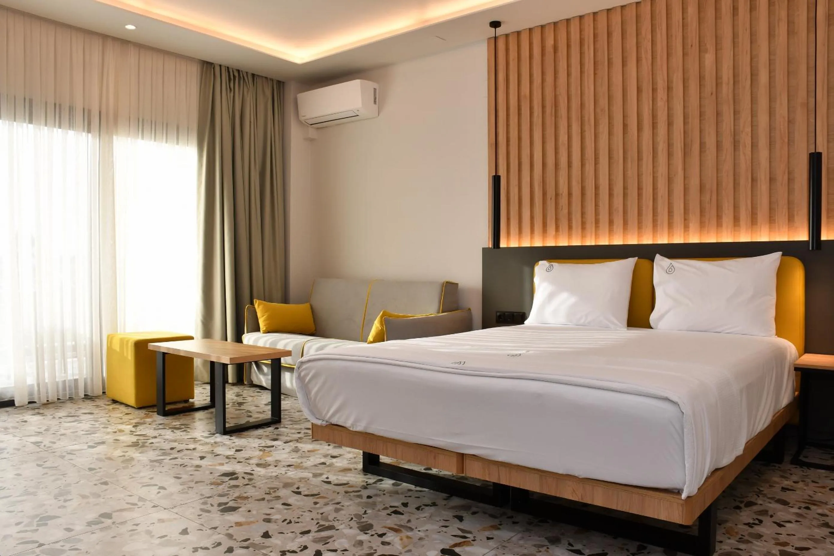 Bed in NERO SEASCAPE SUITES