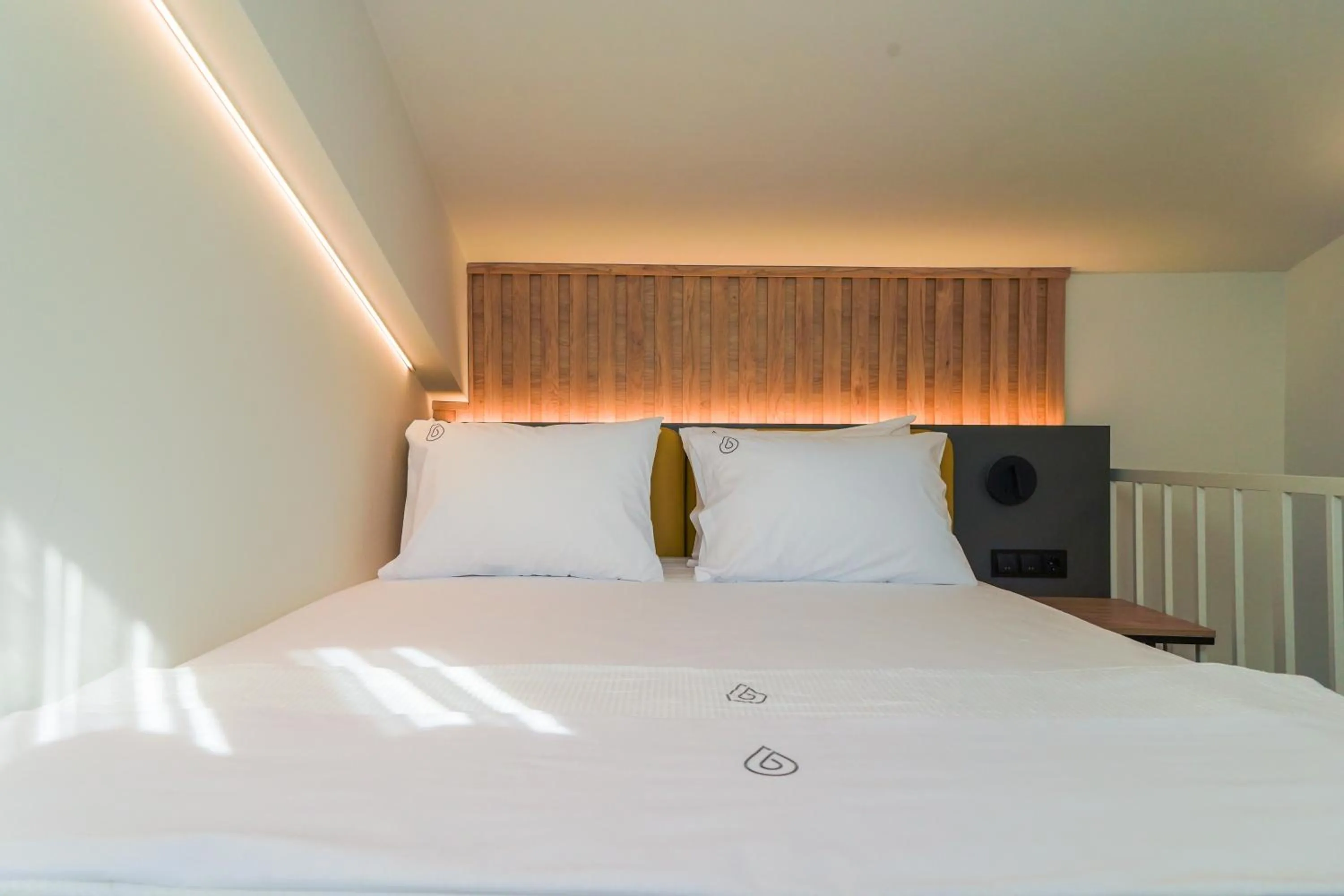 Bed in NERO SEASCAPE SUITES