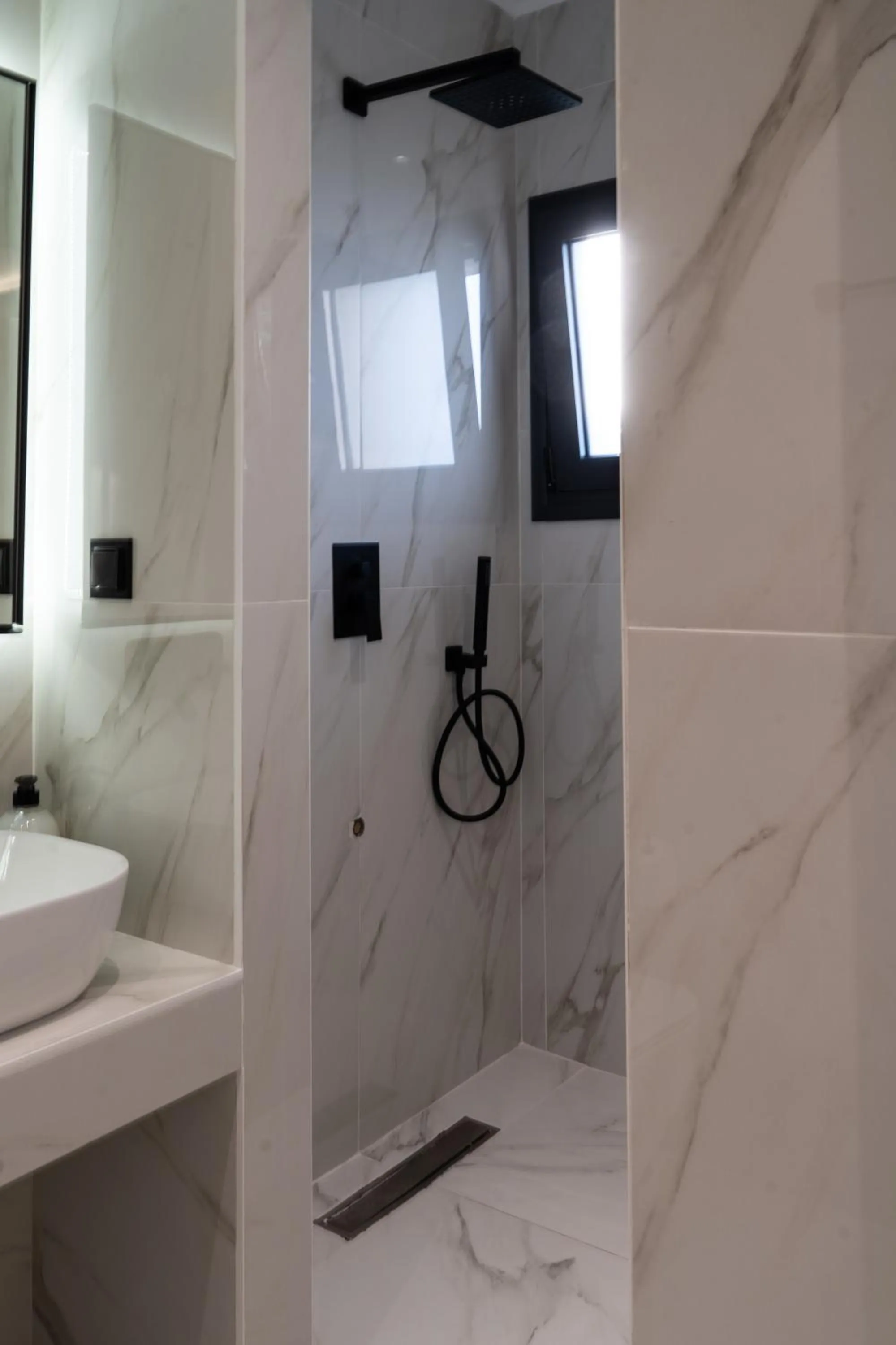 Shower in NERO SEASCAPE SUITES