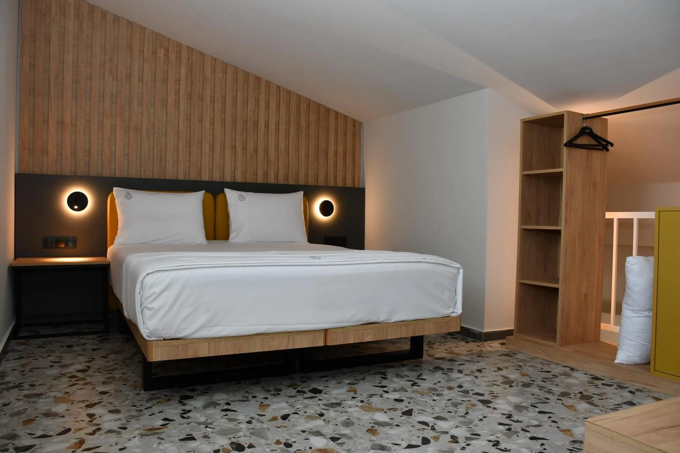 Bed in NERO SEASCAPE SUITES