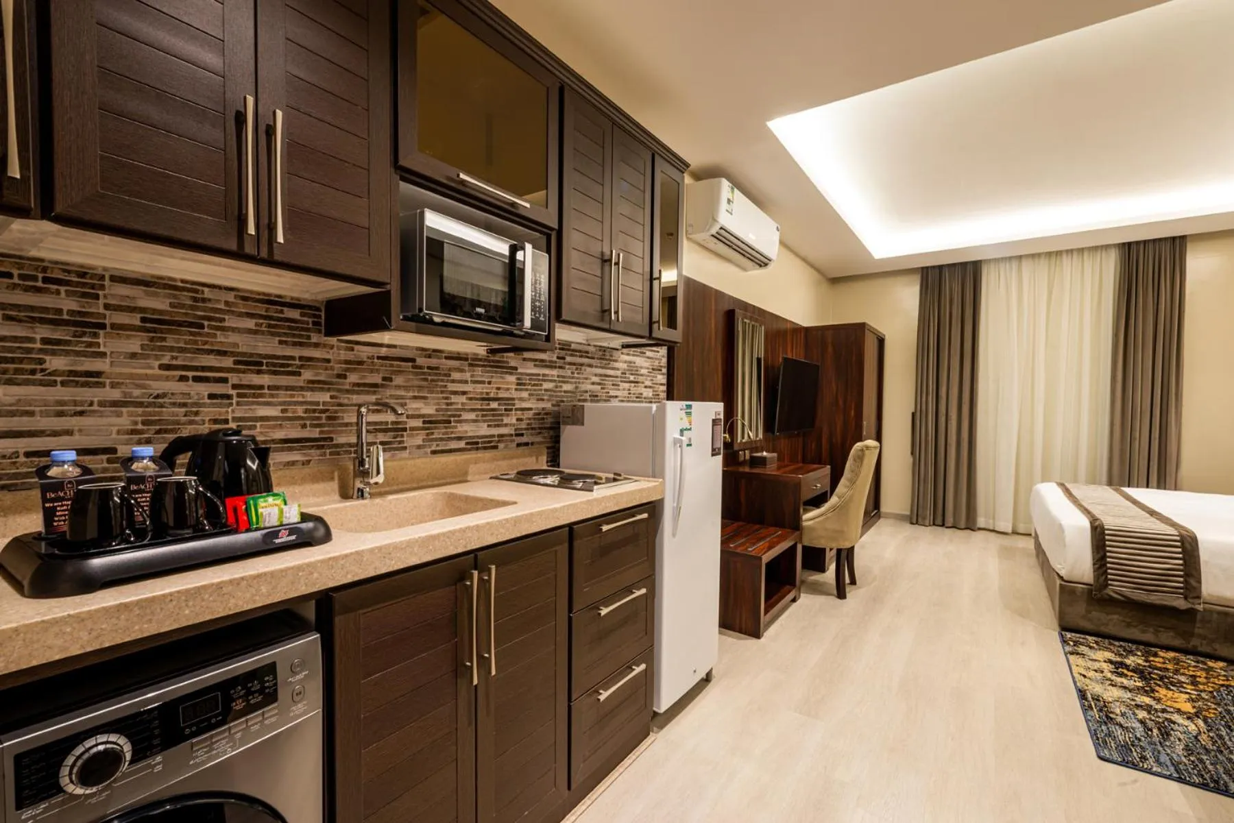 Kitchen or kitchenette, Bed in Beach View Hotel