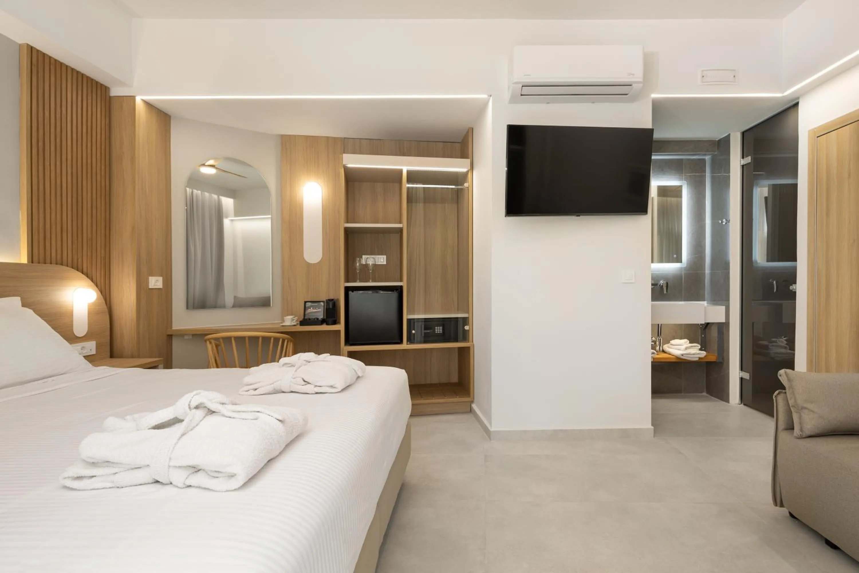 Seating area, Bed in Epavli Grace Hotel