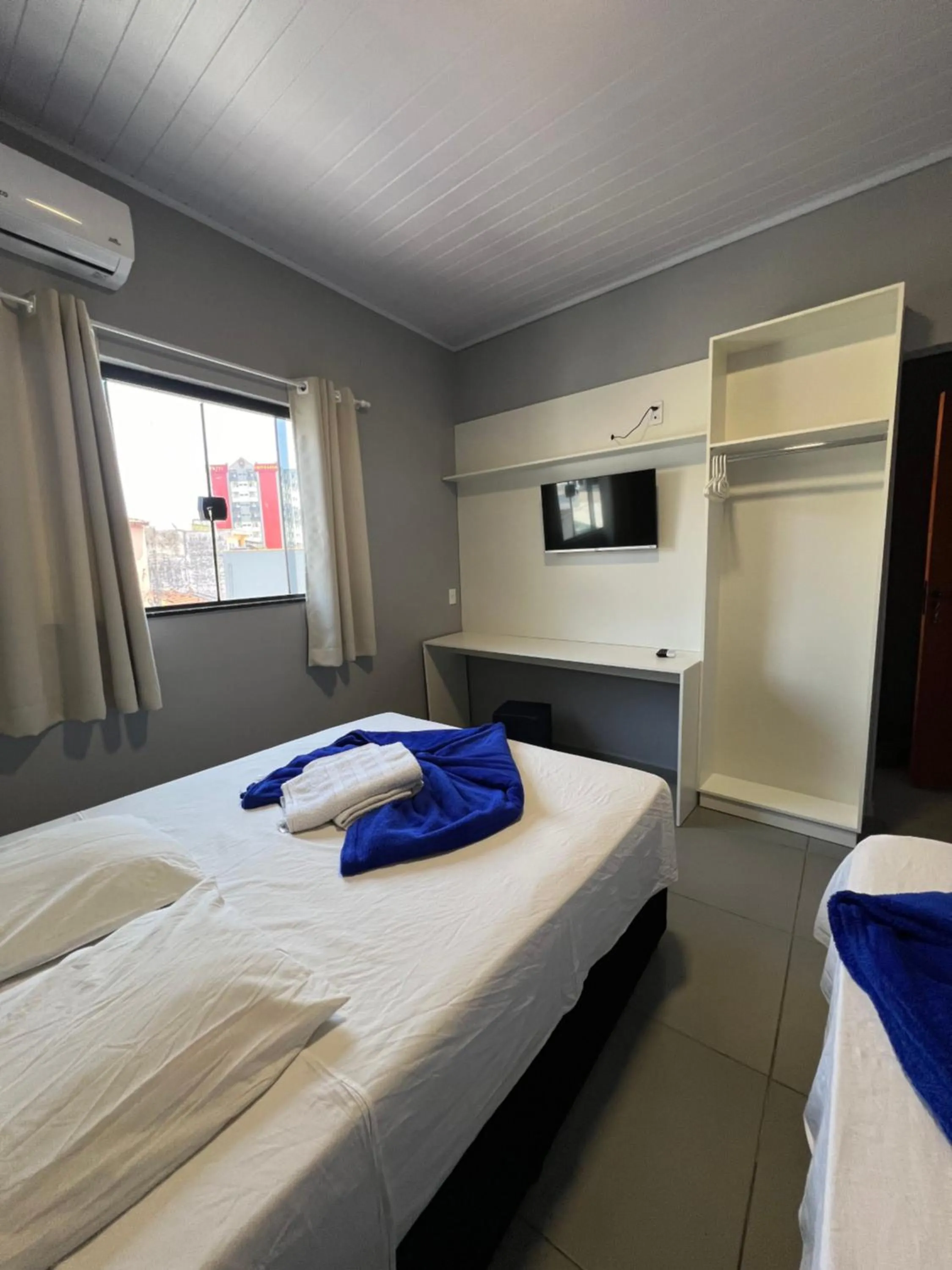 Bed in Hotel Pousada Colliseu