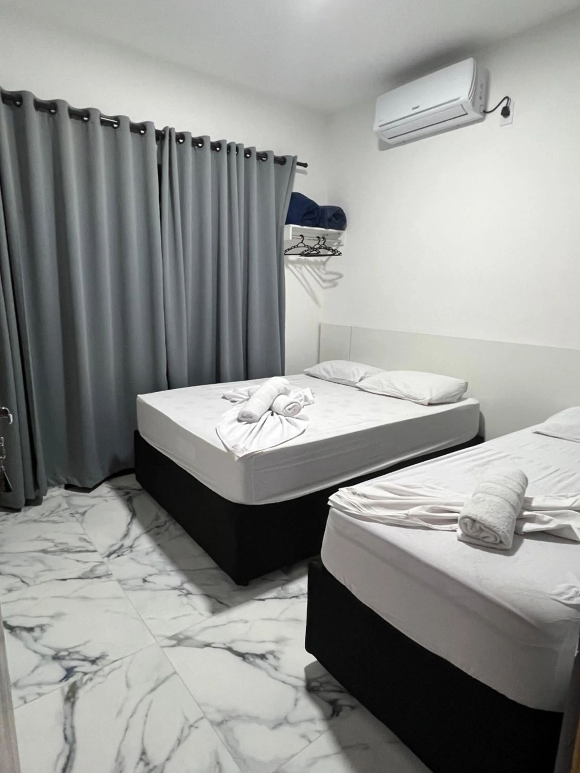 Bed in Hotel Pousada Colliseu