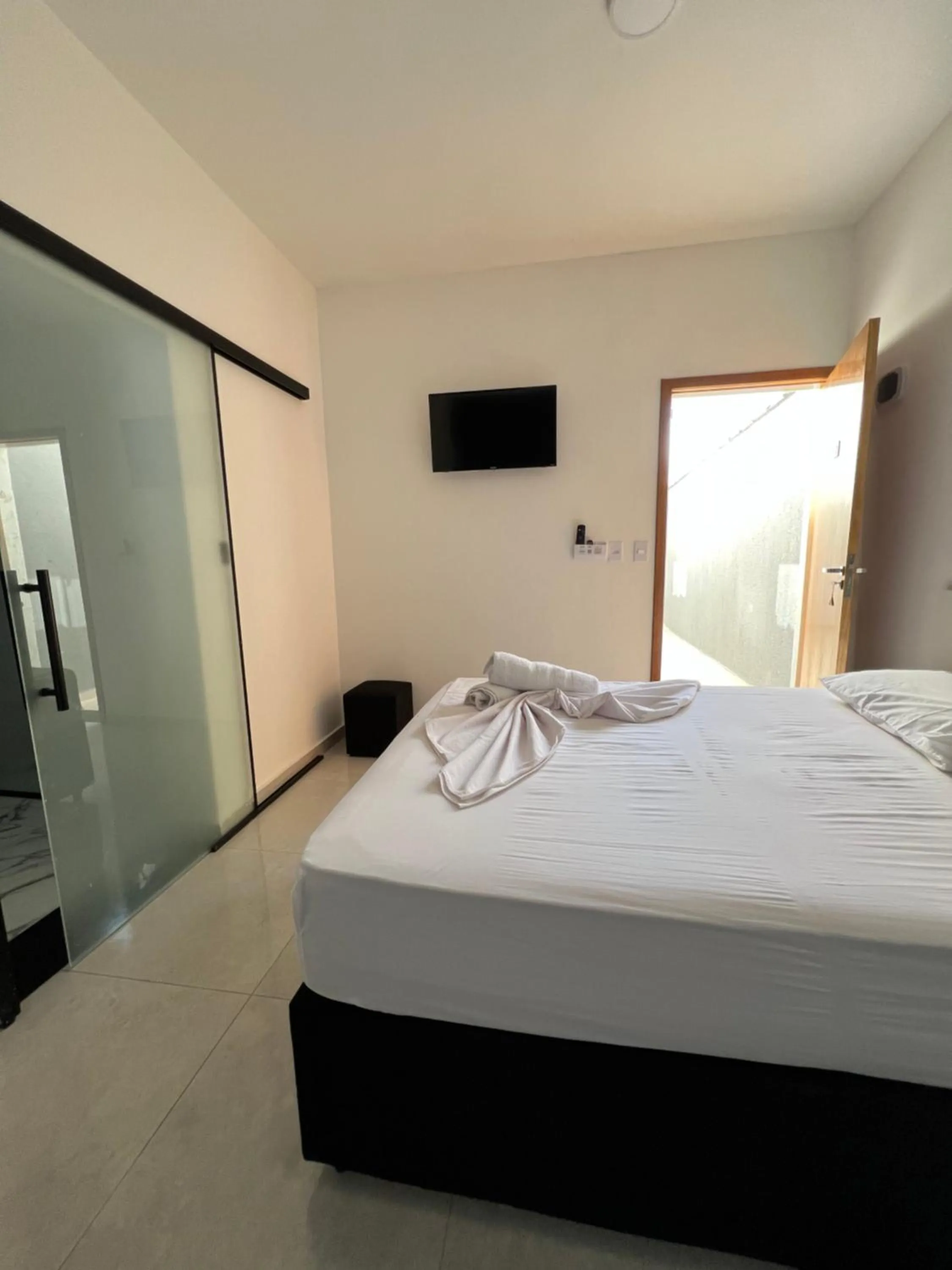 Bed in Hotel Pousada Colliseu