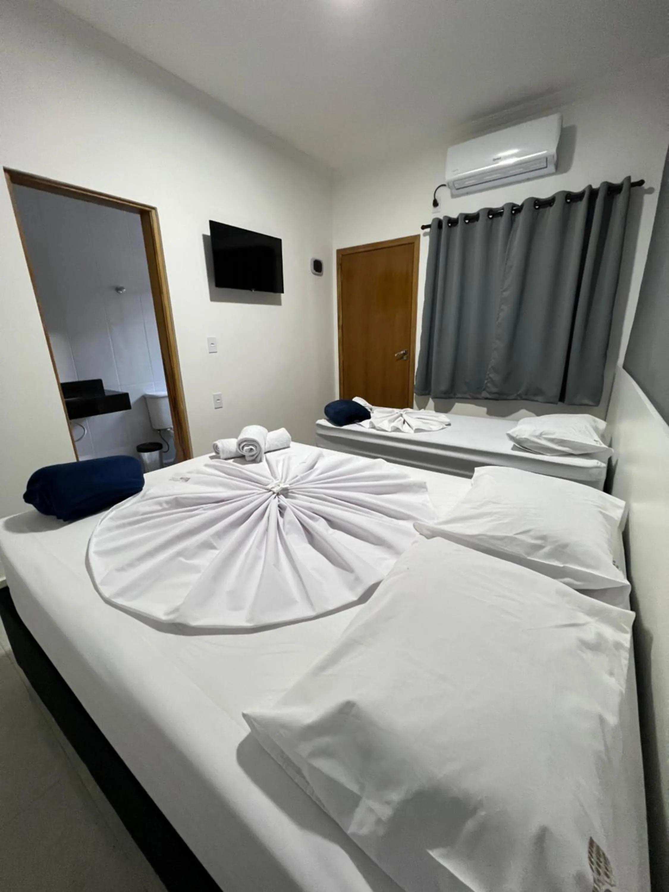 Bed in Hotel Pousada Colliseu