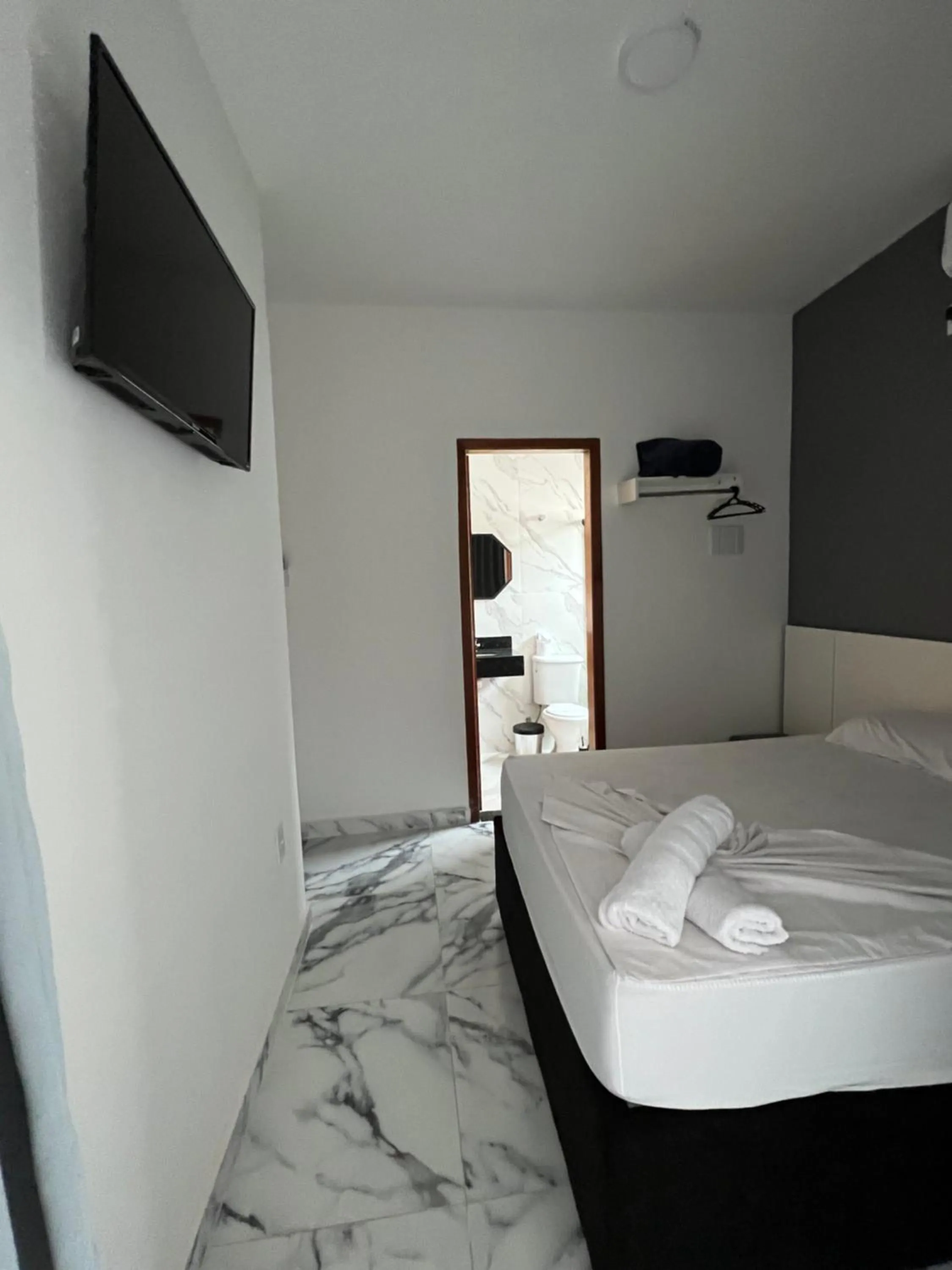 Bed in Hotel Pousada Colliseu