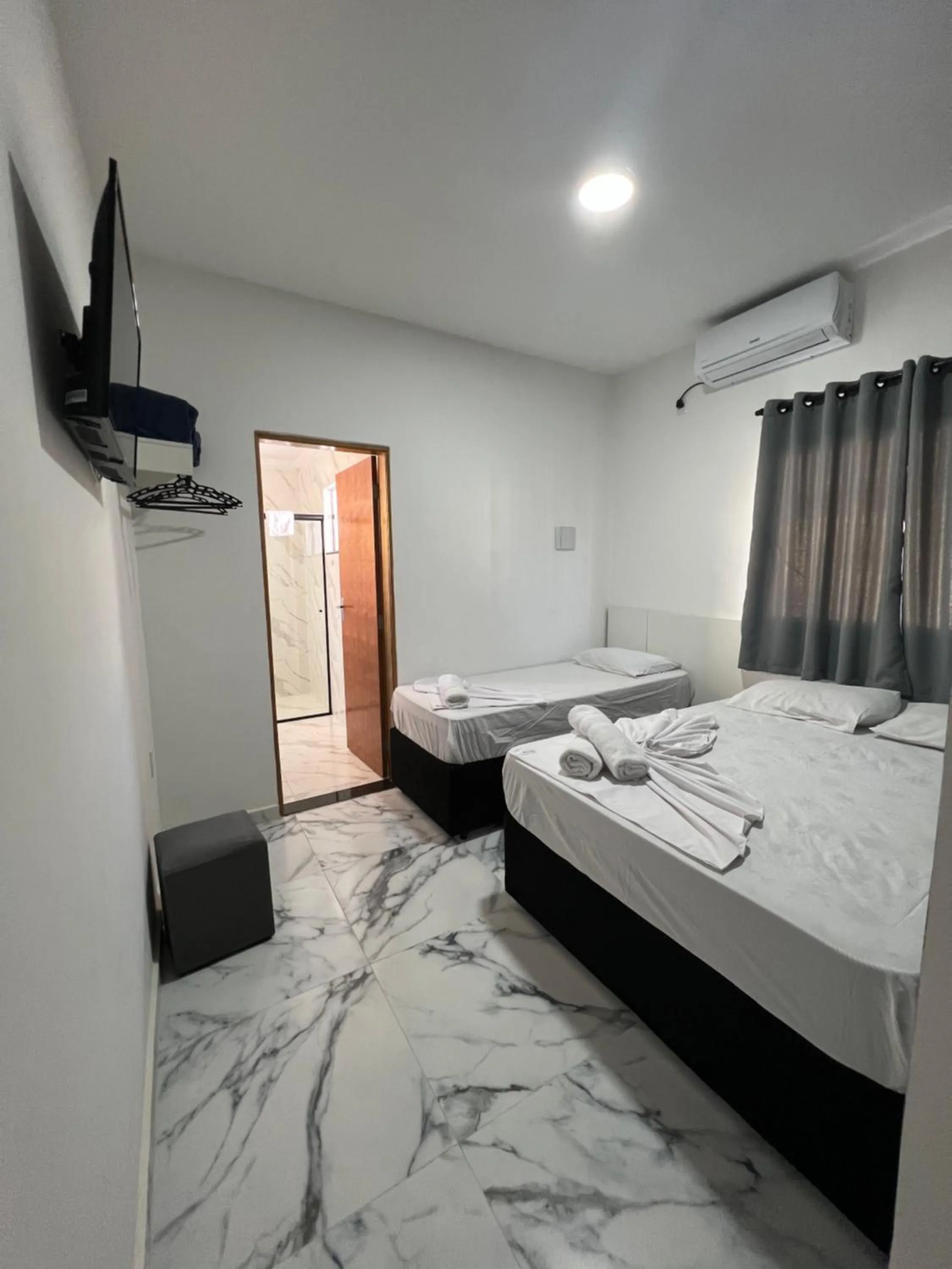 Bed in Hotel Pousada Colliseu