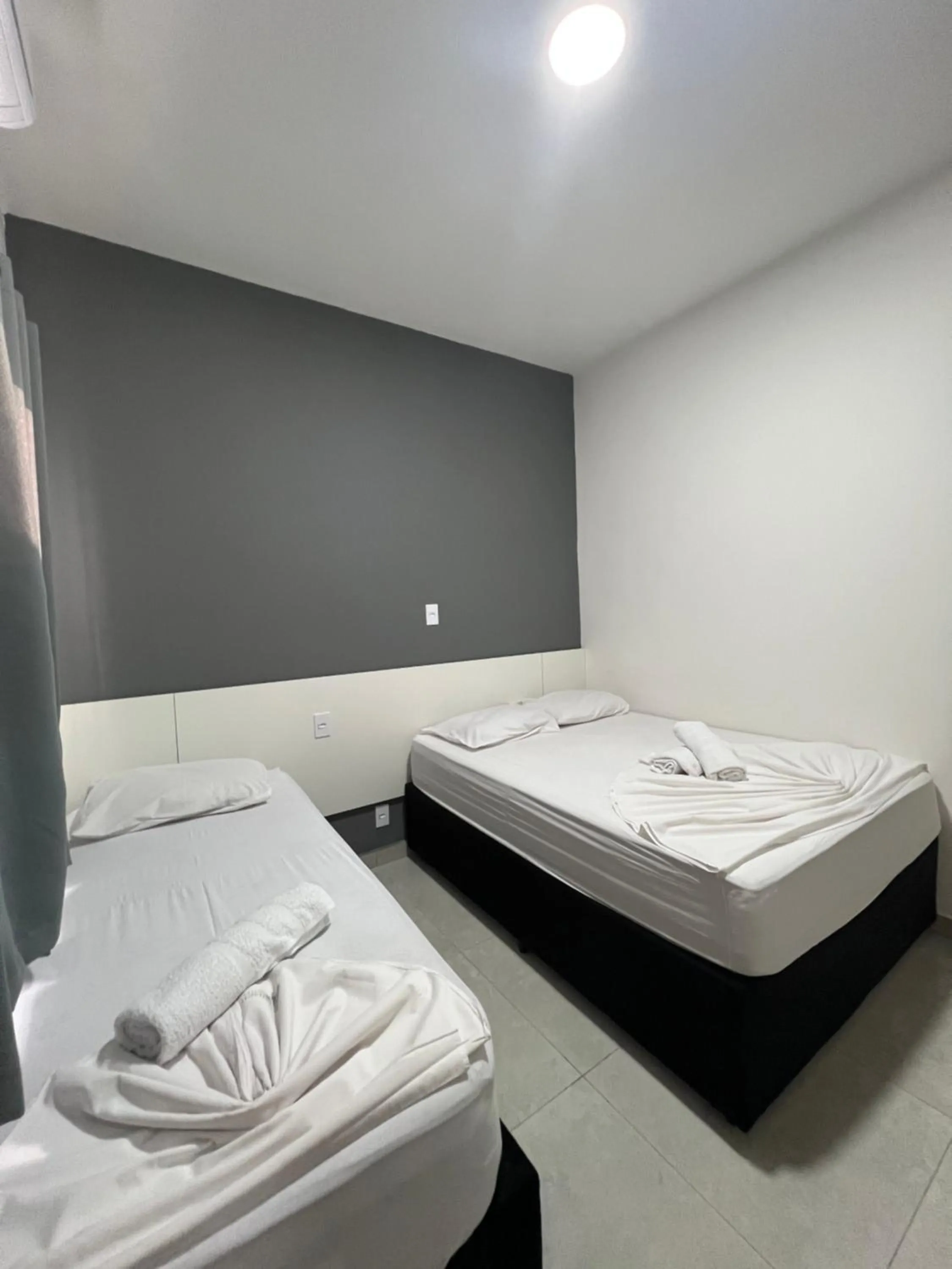 Bed in Hotel Pousada Colliseu