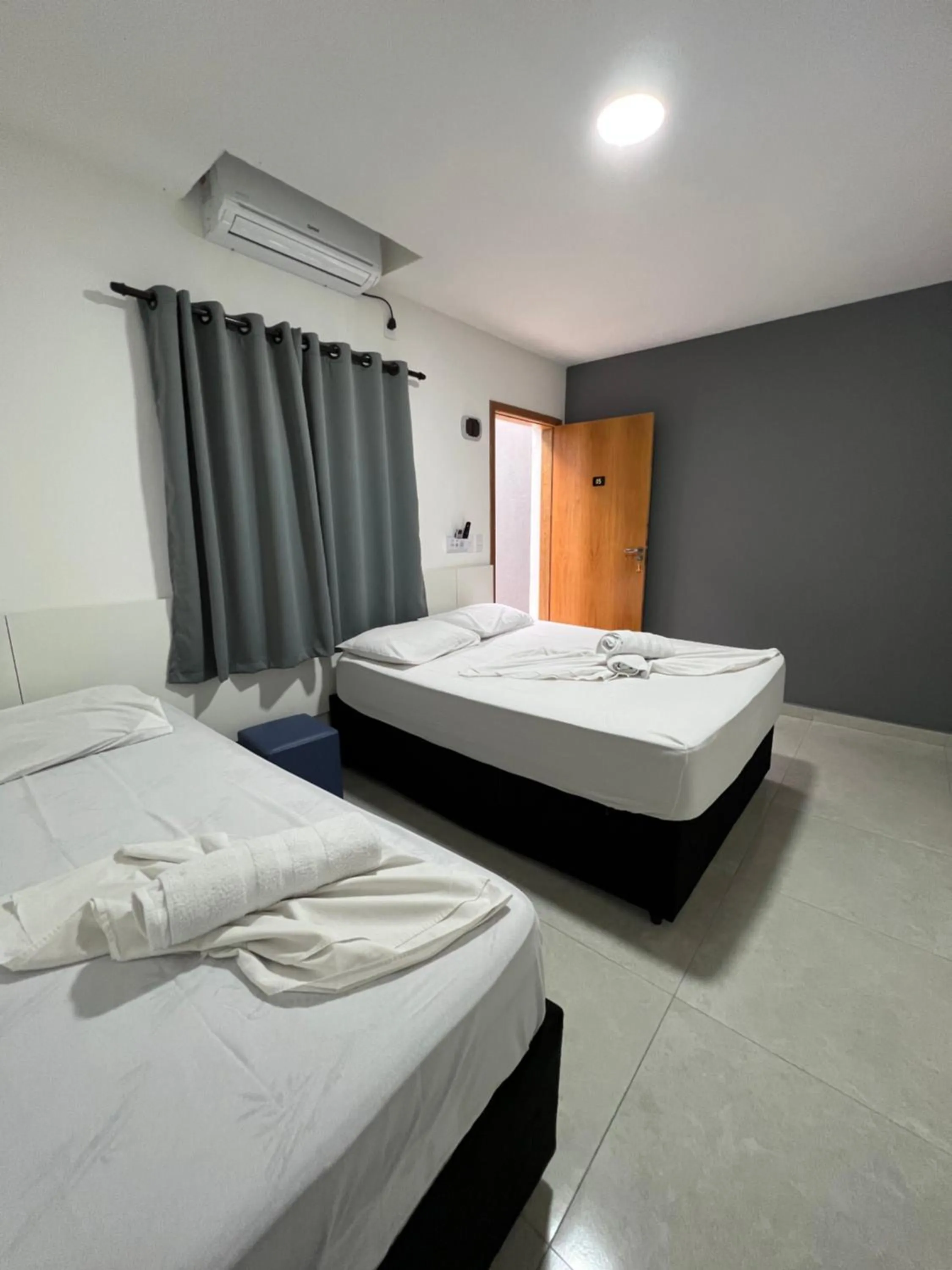 Bed in Hotel Pousada Colliseu