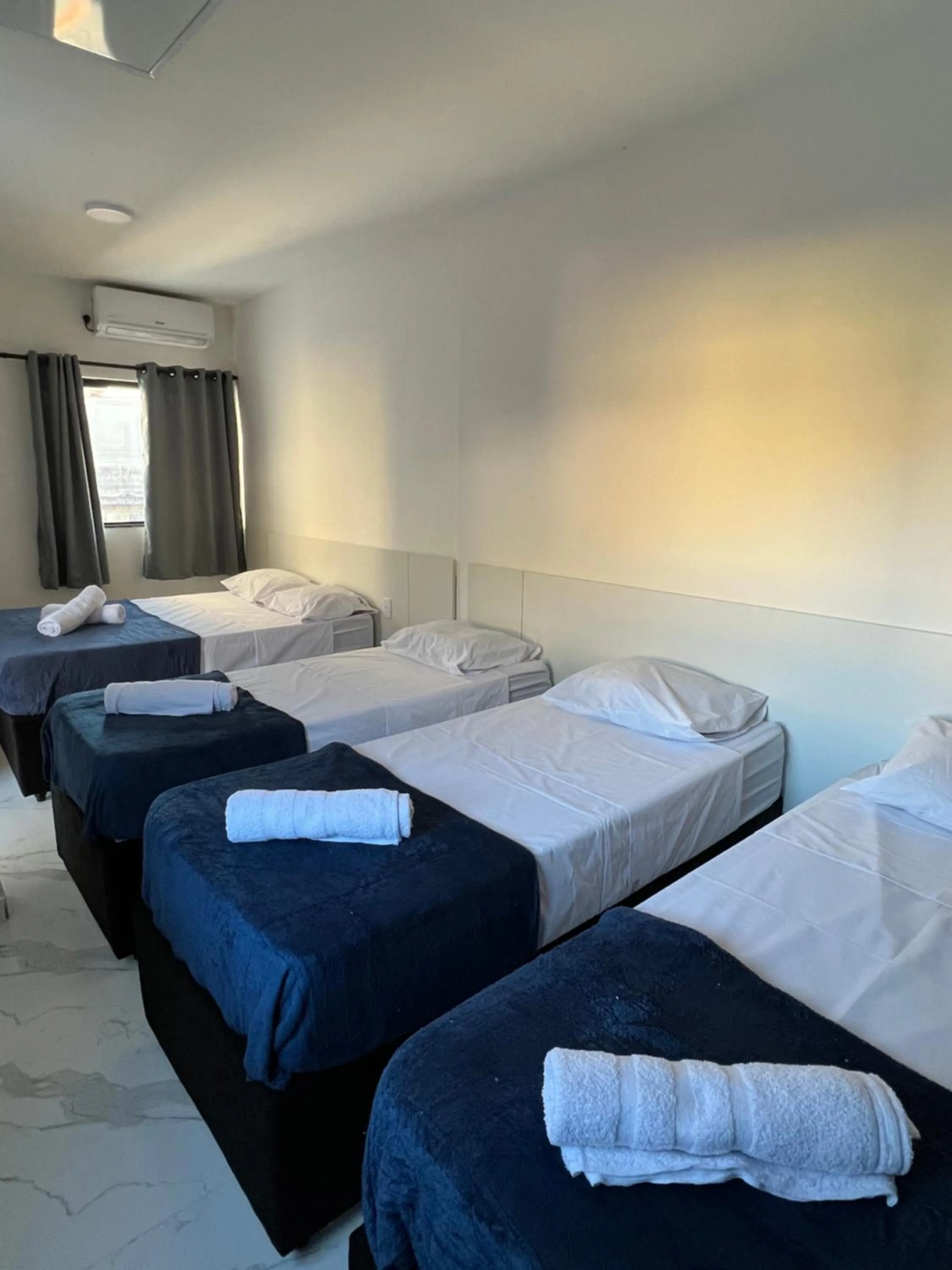 Bed in Hotel Pousada Colliseu