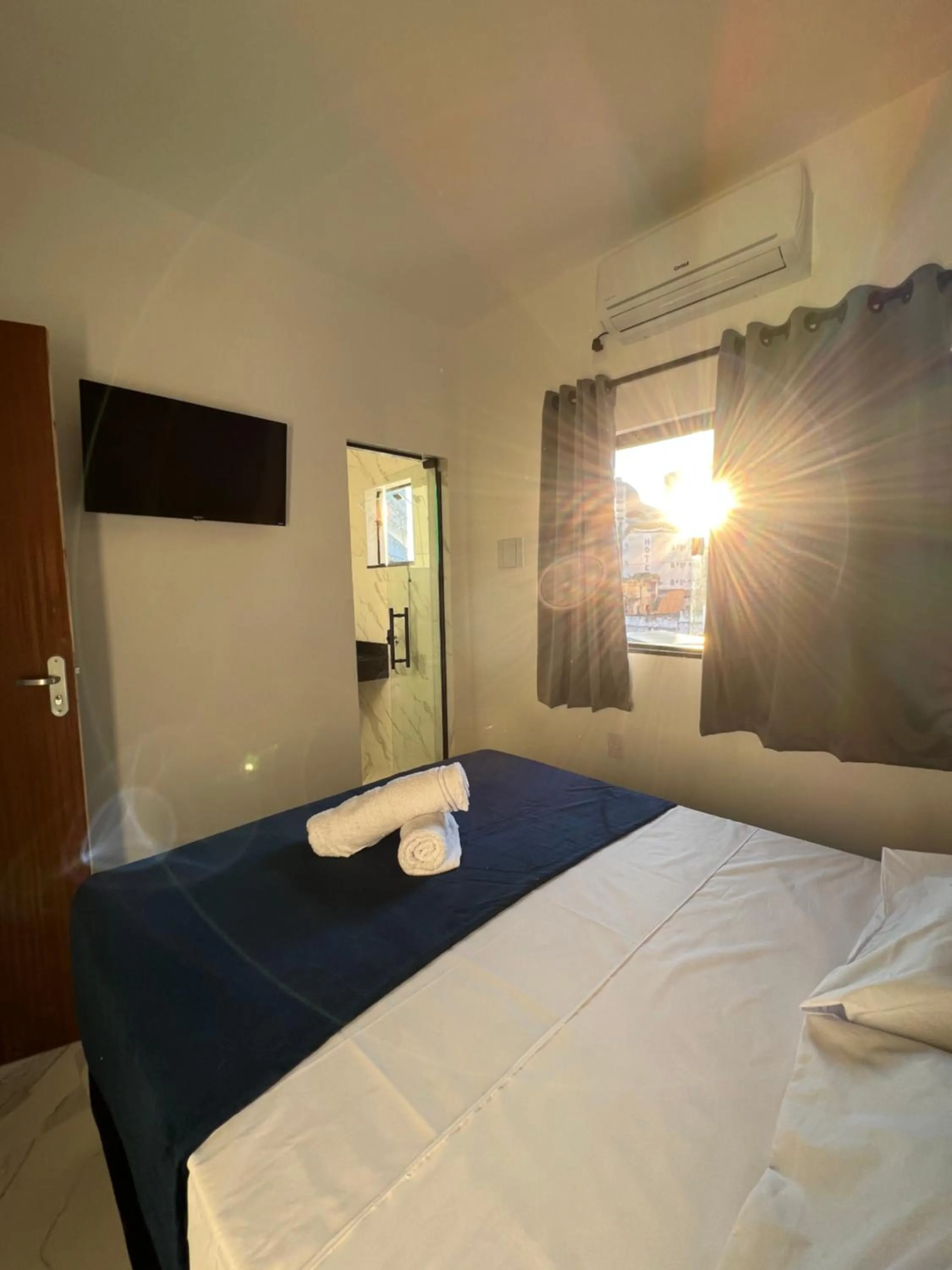 Bed in Hotel Pousada Colliseu