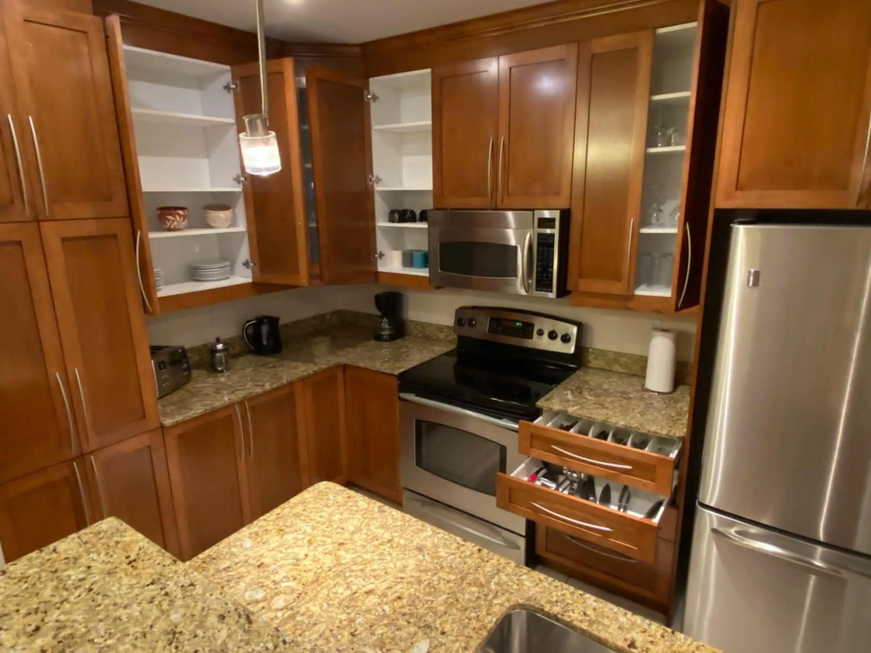 Kitchen or kitchenette in ApartHotelMontreal by Les Terrasses Saint Urbain 2225I2
