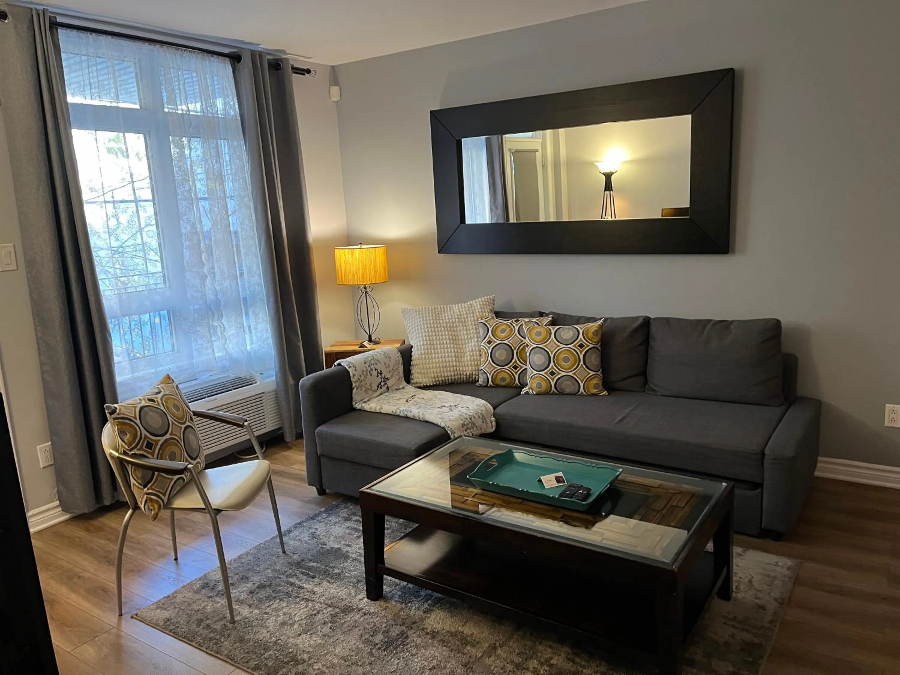 Living room in ApartHotelMontreal by Les Terrasses Saint Urbain 2225I2