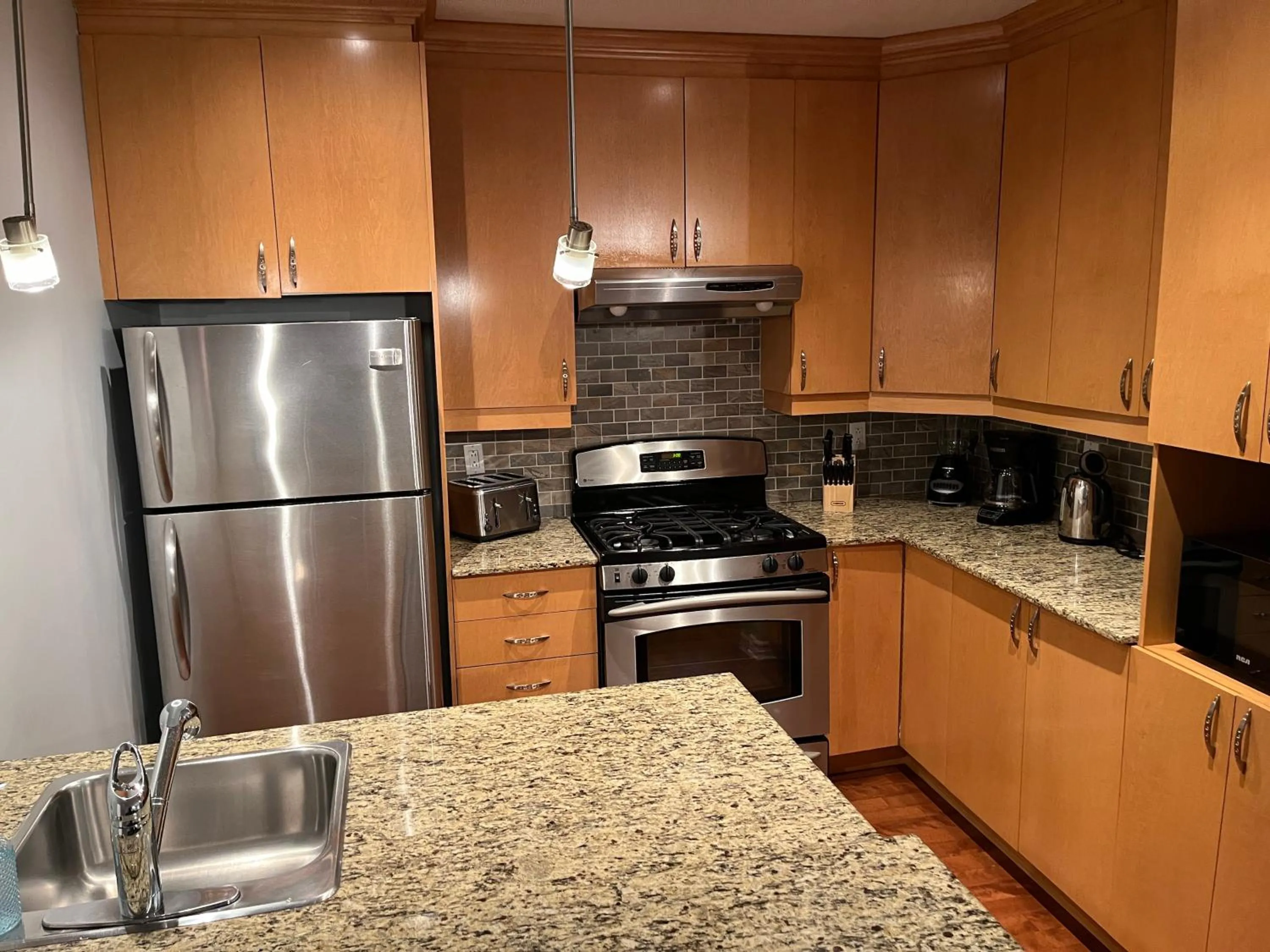 kitchen in ApartHotelMontreal by Les Terrasses Saint Urbain 2225I2